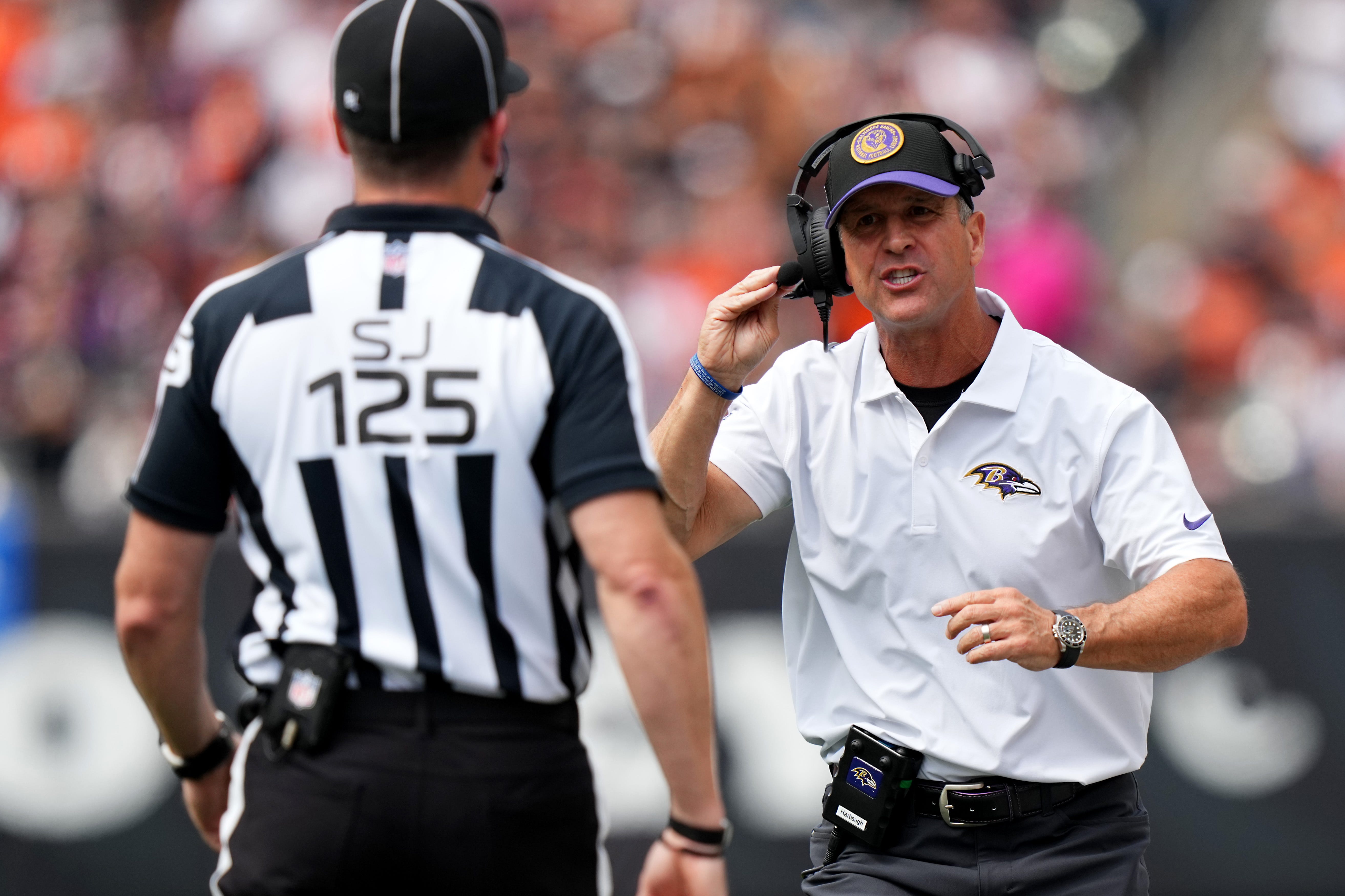 Baltimore Ravens coach coach John Harbaugh argues with side judge Chad Hill (125) in the second quarter of a Week 2 NFL football game between the Baltimore Ravens and the Cincinnati Bengals Sunday, Sept. 17, 2023, at Paycor Stadium in Cincinnati.