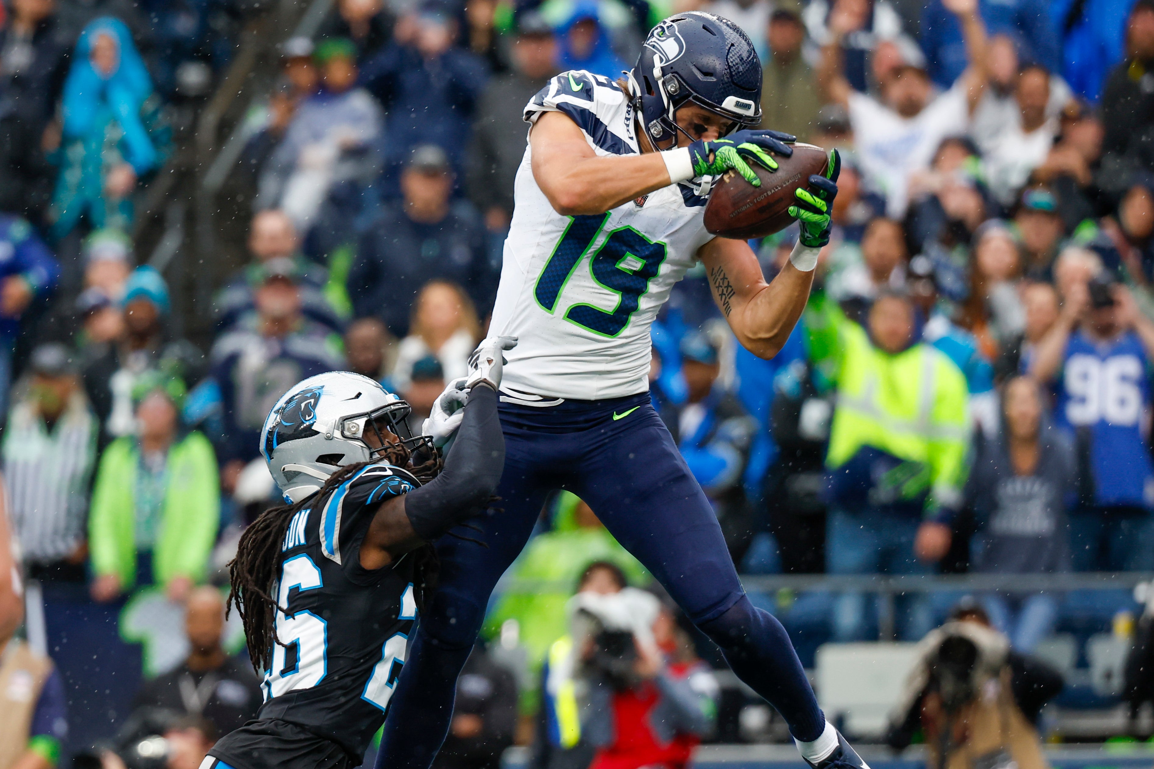 Sep 24, 2023; Seattle, Washington, USA; Seattle Seahawks wide receiver Jake Bobo (19) catches a touchdown pass against Carolina Panthers cornerback Donte Jackson (26) during the fourth quarter at Lumen Field. Mandatory Credit: Joe Nicholson-USA TODAY Sports