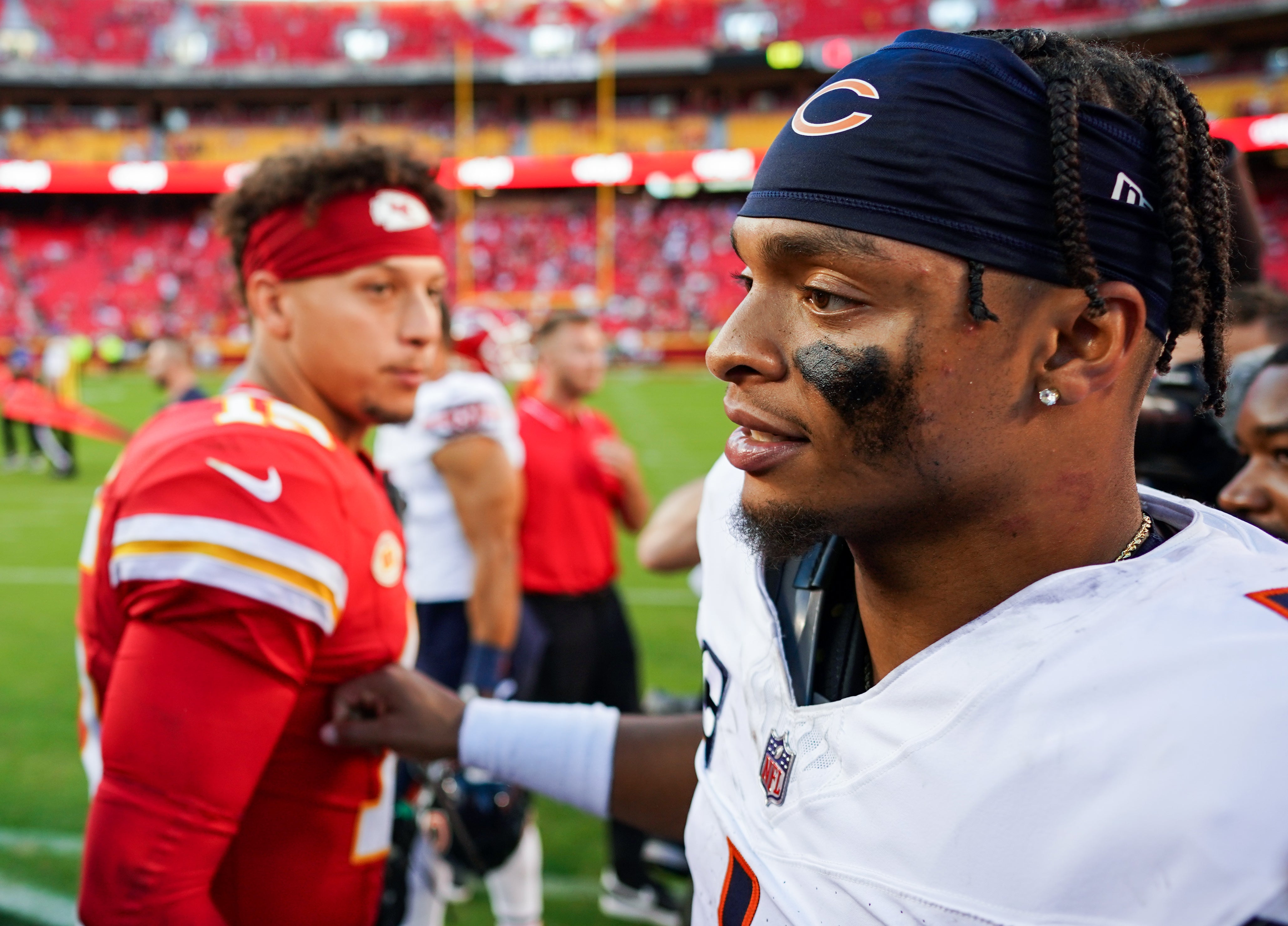 Sep 24, 2023; Kansas City, Missouri, USA; Chicago Bears quarterback Justin Fields (1) greets Kansas City Chiefs quarterback Patrick Mahomes (15) after a game at GEHA Field at Arrowhead Stadium. Mandatory Credit: Jay Biggerstaff-USA TODAY Sports