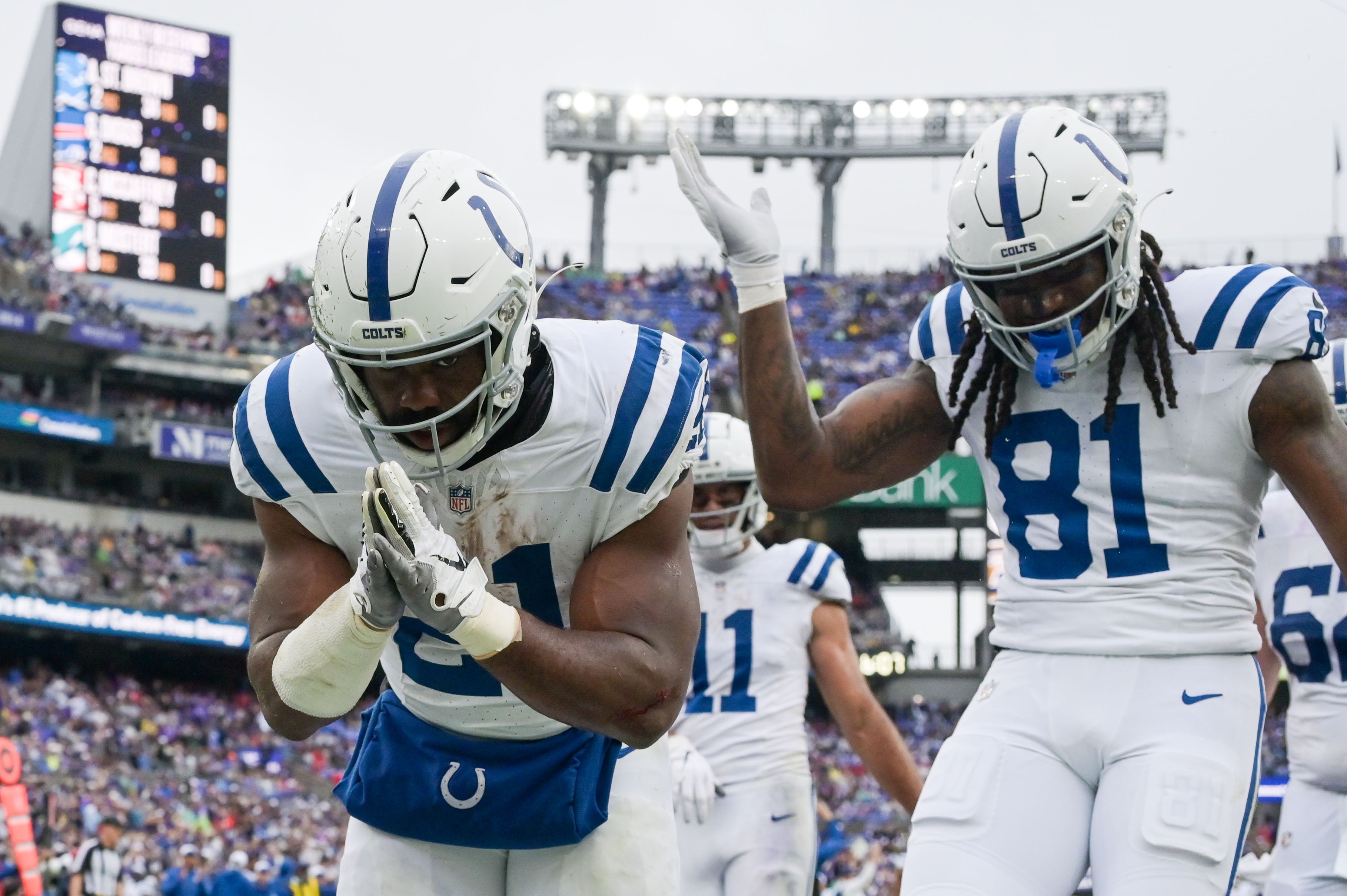 Sep 24, 2023; Baltimore, Maryland, USA; Indianapolis Colts running back Zack Moss (21) celebrates after scoring a touchdown during the first half against the Baltimore Ravens at M&T Bank Stadium.