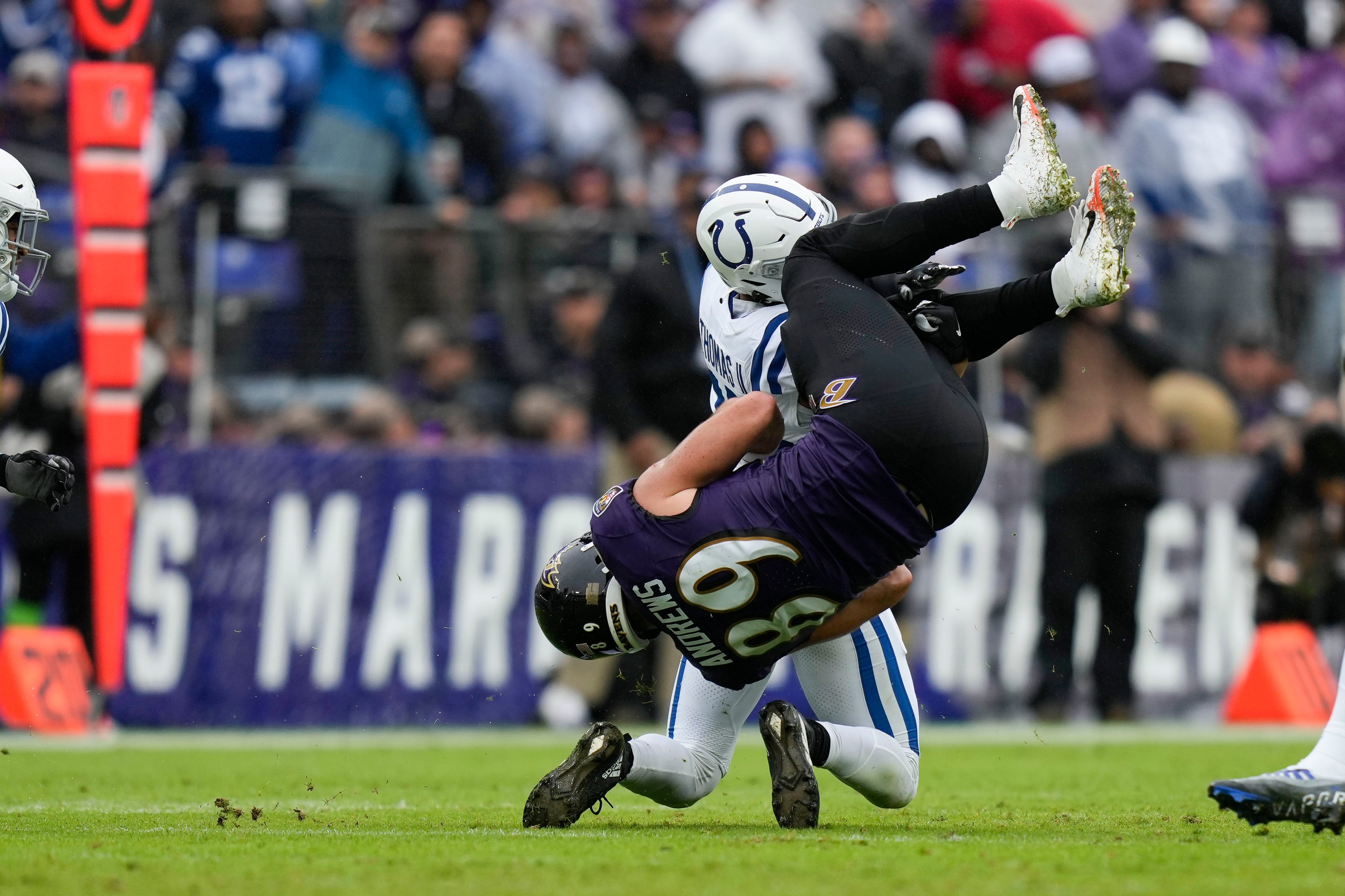 Sep 24, 2023; Baltimore, Maryland, USA;Baltimore Ravens tight end Mark Andrews (89) catches a pass in the first quarter while being defended by Indianapolis Colts safety Rodney Thomas II (25) at M&T Bank Stadium. Mandatory Credit: Brent Skeen-USA TODAY Sports