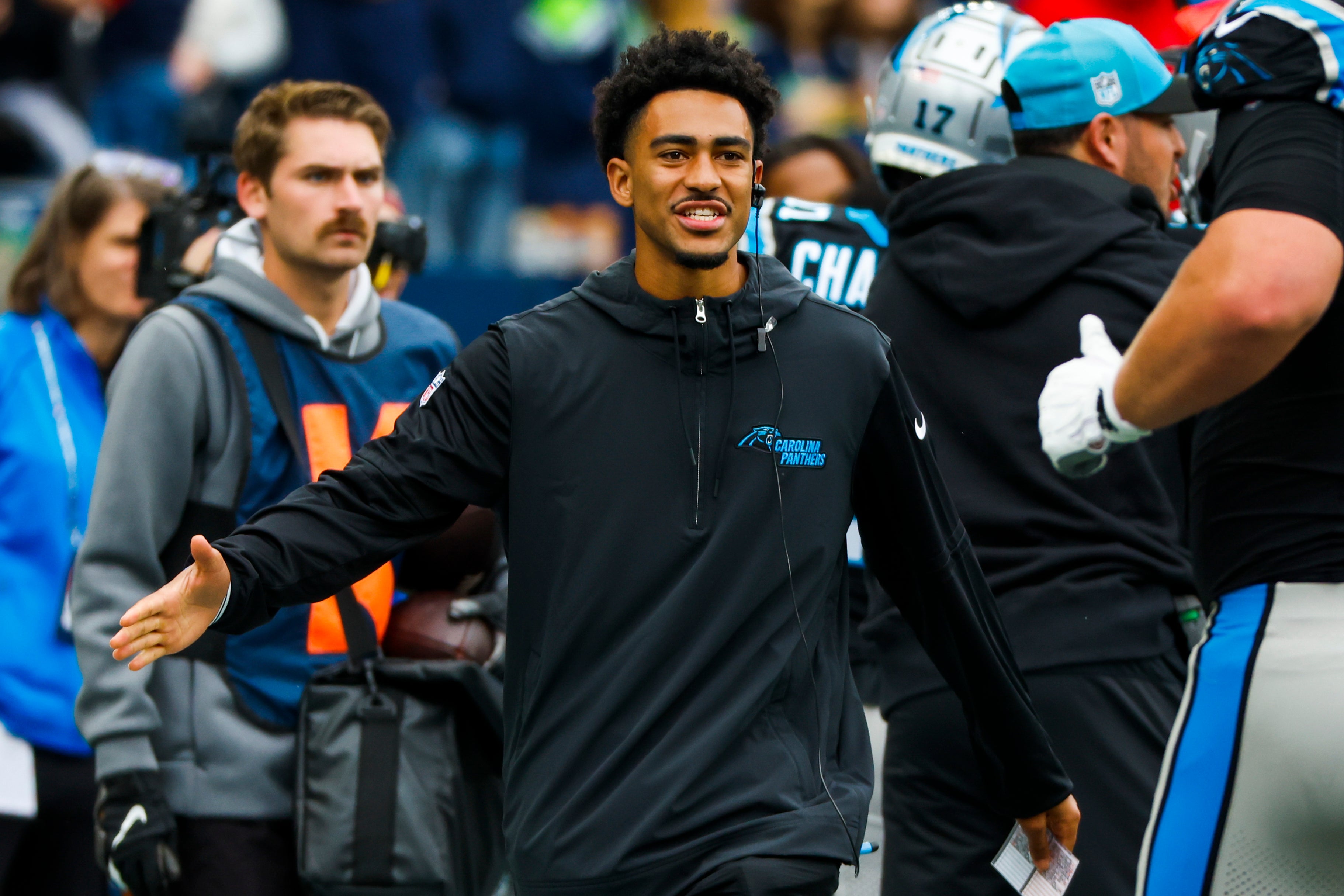 Sep 24, 2023; Seattle, Washington, USA; Carolina Panthers quarterback Bryce Young (9) greets a teammate on the sideline following a touchdown against the Seattle Seahawks during the second quarter at Lumen Field. Mandatory Credit: Joe Nicholson-USA TODAY Sports.
