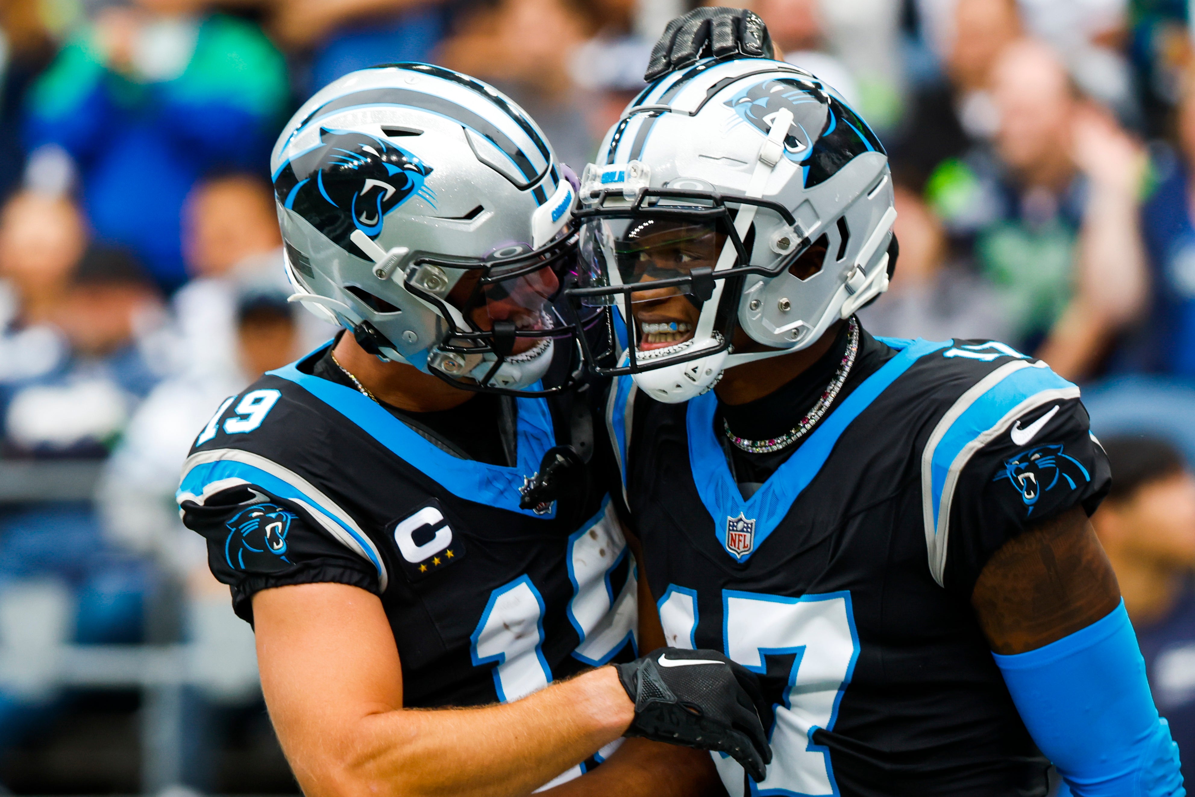 Sep 24, 2023; Seattle, Washington, USA; Carolina Panthers wide receiver DJ Chark Jr. (17) celebrates with wide receiver Adam Thielen (19) after catching a touchdown pass against the Seattle Seahawks during the second quarter at Lumen Field. Mandatory Credit: Joe Nicholson-USA TODAY Sports