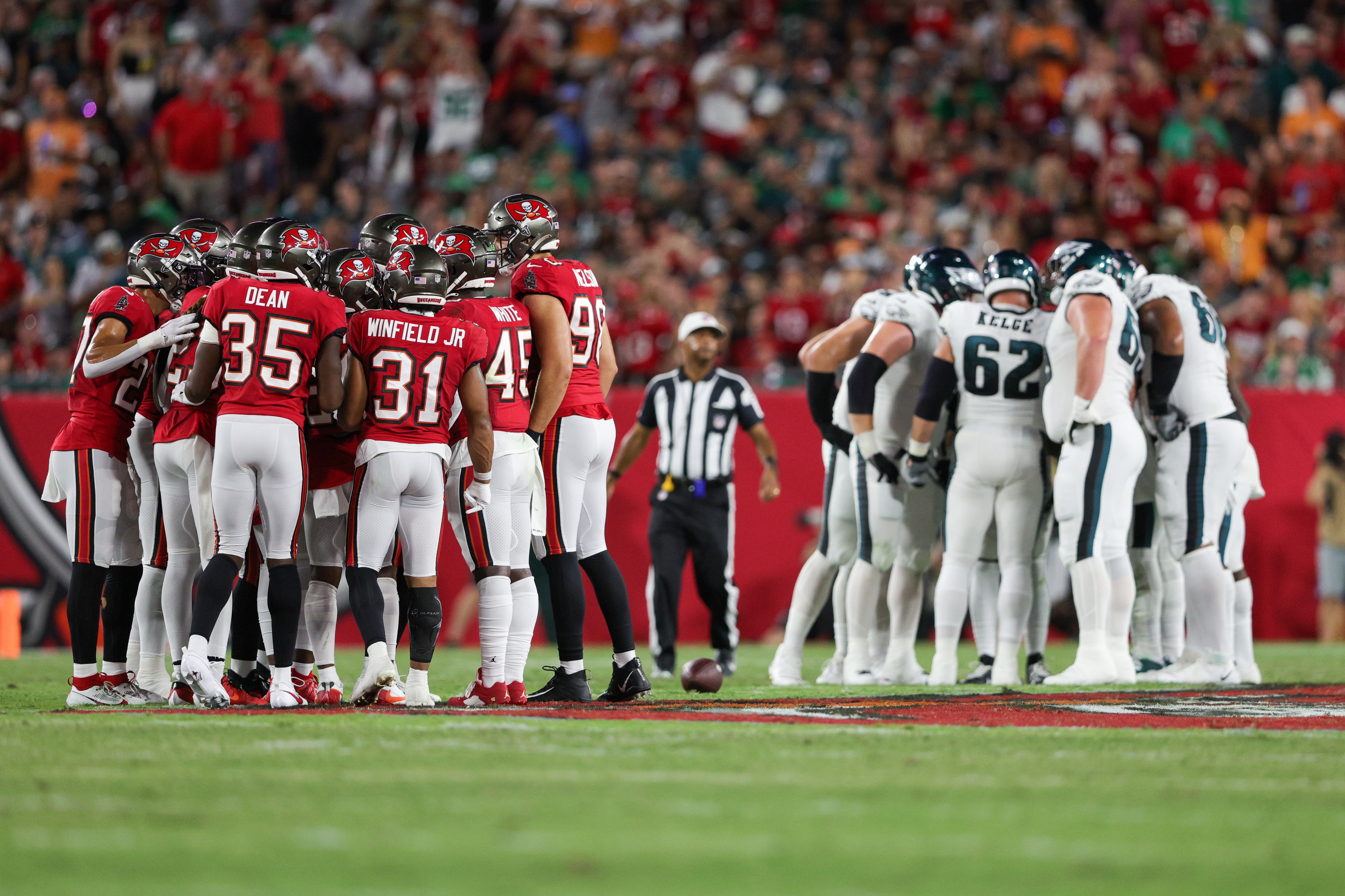 Sep 25, 2023; Tampa, Florida, USA; the Tampa Bay Buccaneers and Philadelphia Eagles huddle in the second quarter at Raymond James Stadium. Mandatory Credit: Nathan Ray Seebeck-USA TODAY Sports