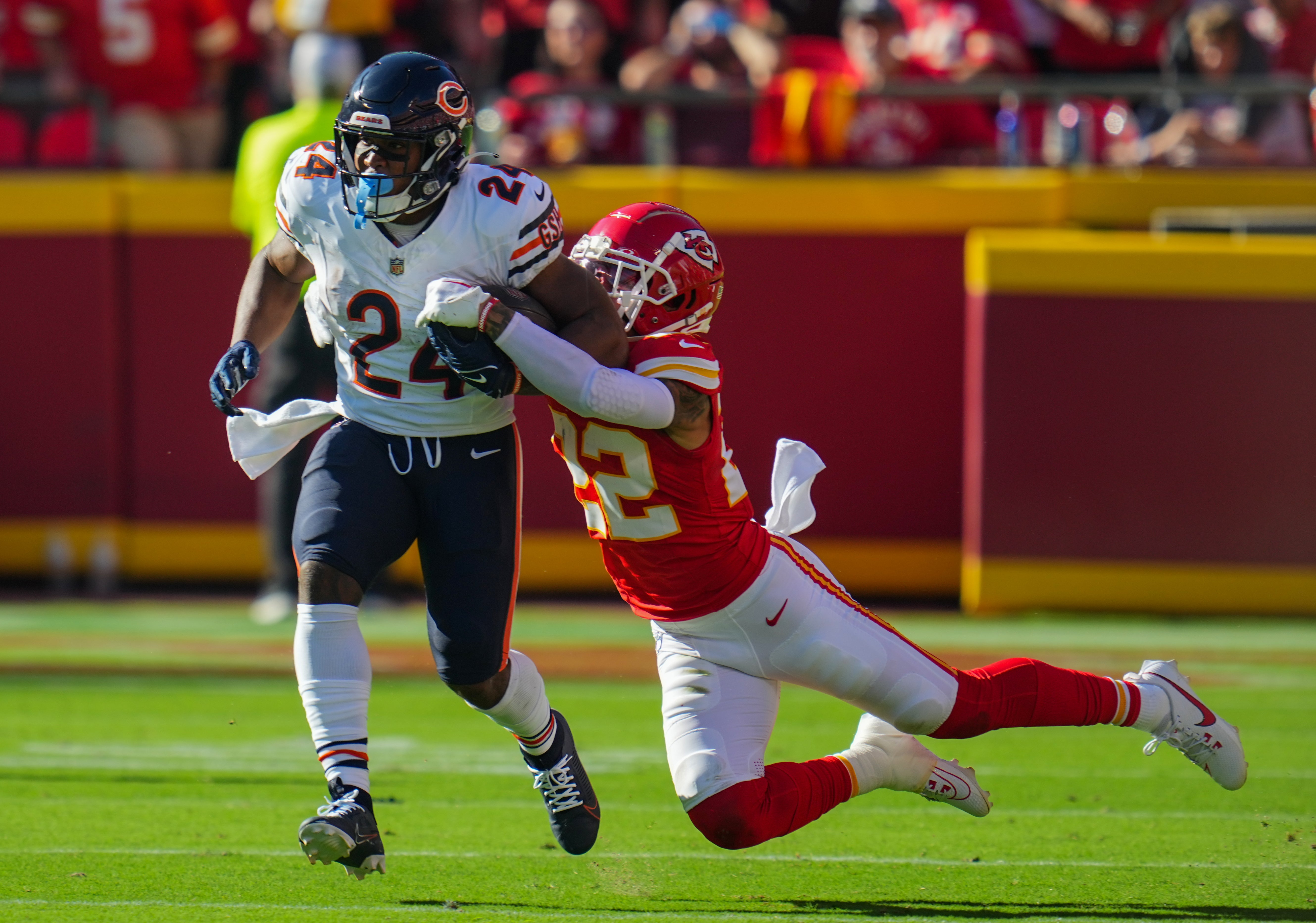 Sep 24, 2023; Kansas City, Missouri, USA; Chicago Bears running back Khalil Herbert (24) fumbles as he is tackled by Kansas City Chiefs cornerback Trent McDuffie (22) during the first half at GEHA Field at Arrowhead Stadium.