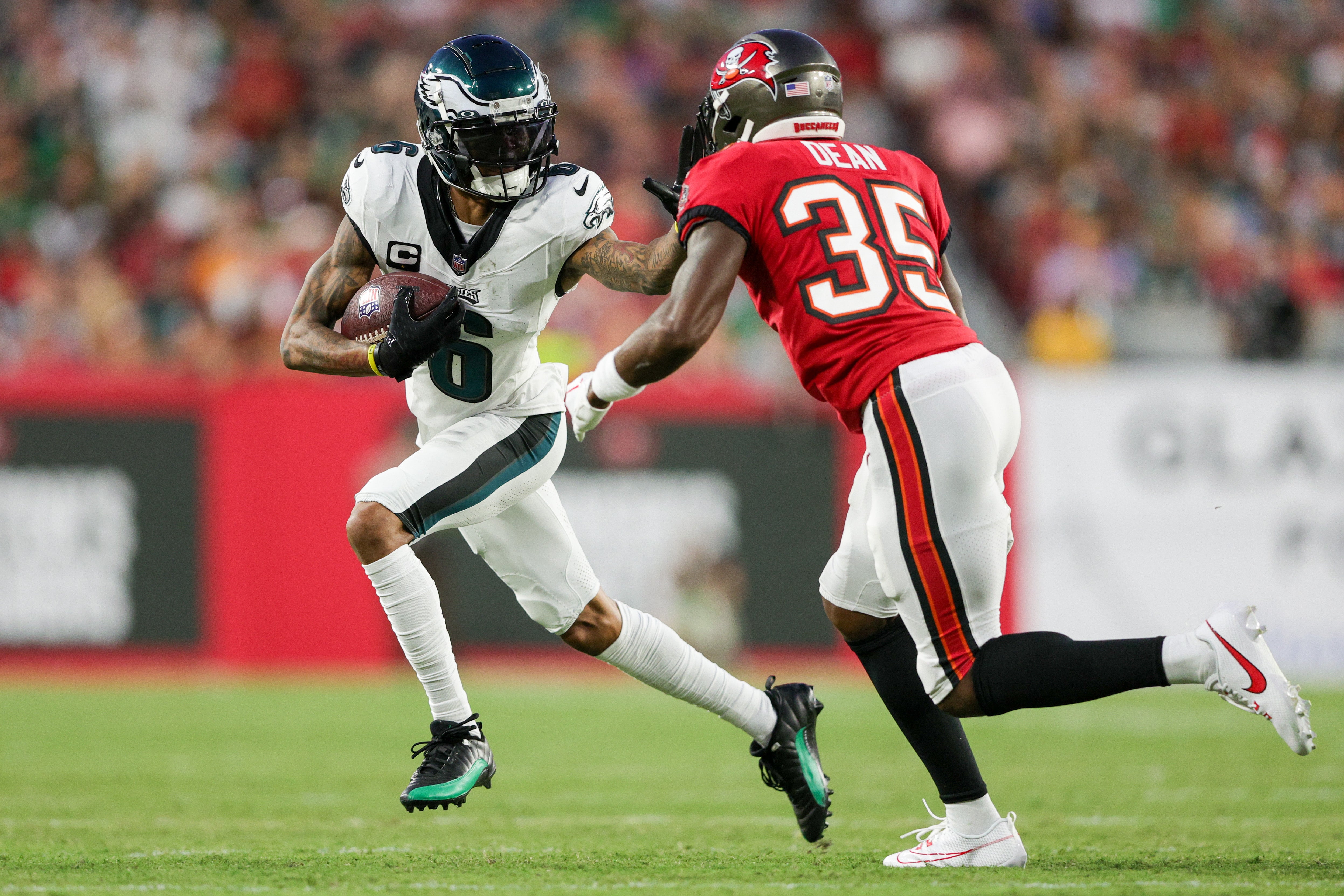 Sep 25, 2023; Tampa, Florida, USA; Philadelphia Eagles wide receiver DeVonta Smith (6) stiff arms Tampa Bay Buccaneers cornerback Jamel Dean (35) in the first quarter at Raymond James Stadium. Nathan Ray Seebeck-USA TODAY Sports