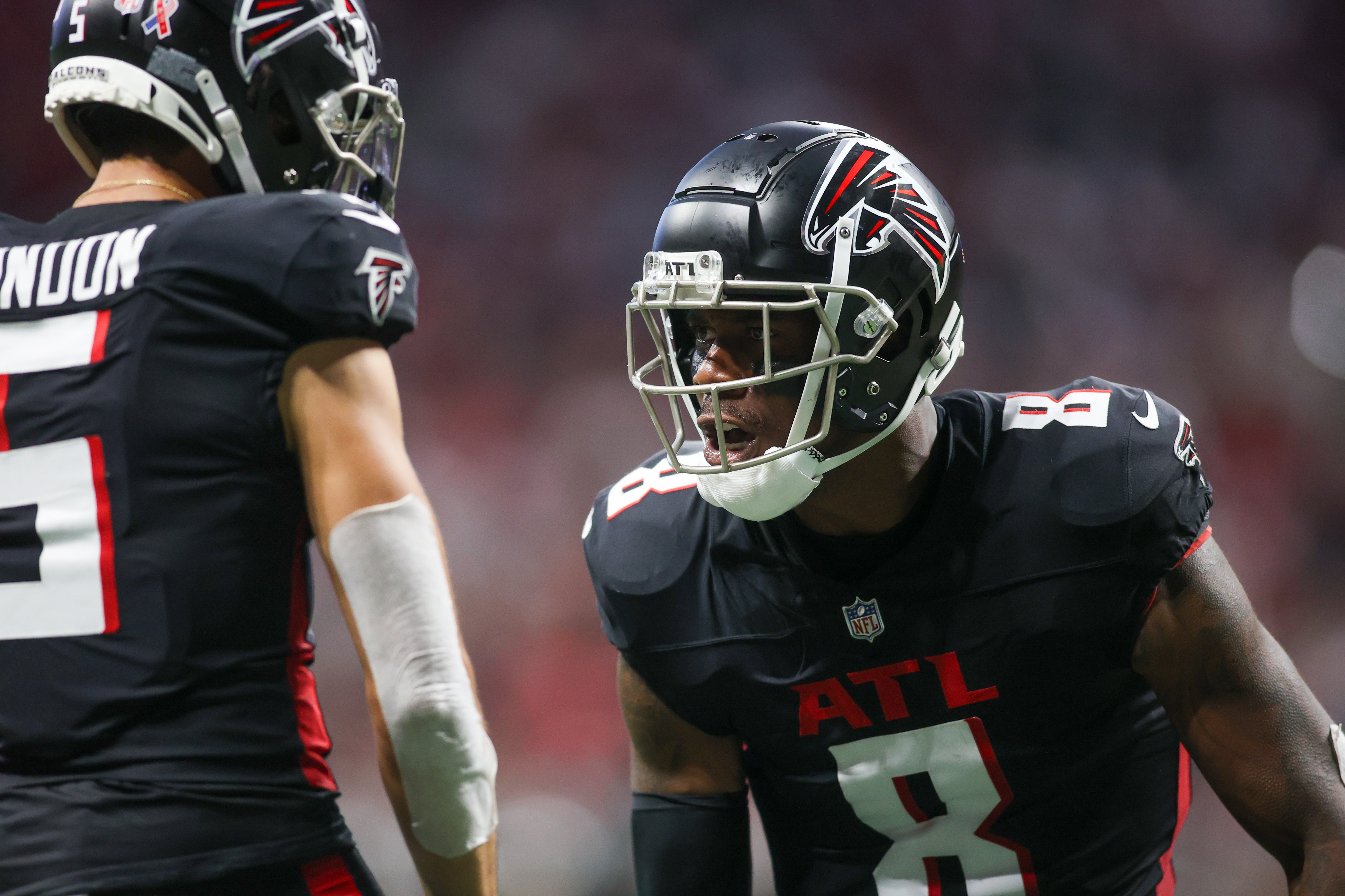 Sep 10, 2023; Atlanta, Georgia, USA; Atlanta Falcons tight end Kyle Pitts (8) reacts with wide receiver Drake London (5) after a catch against the Carolina Panthers in the second half at Mercedes-Benz Stadium.