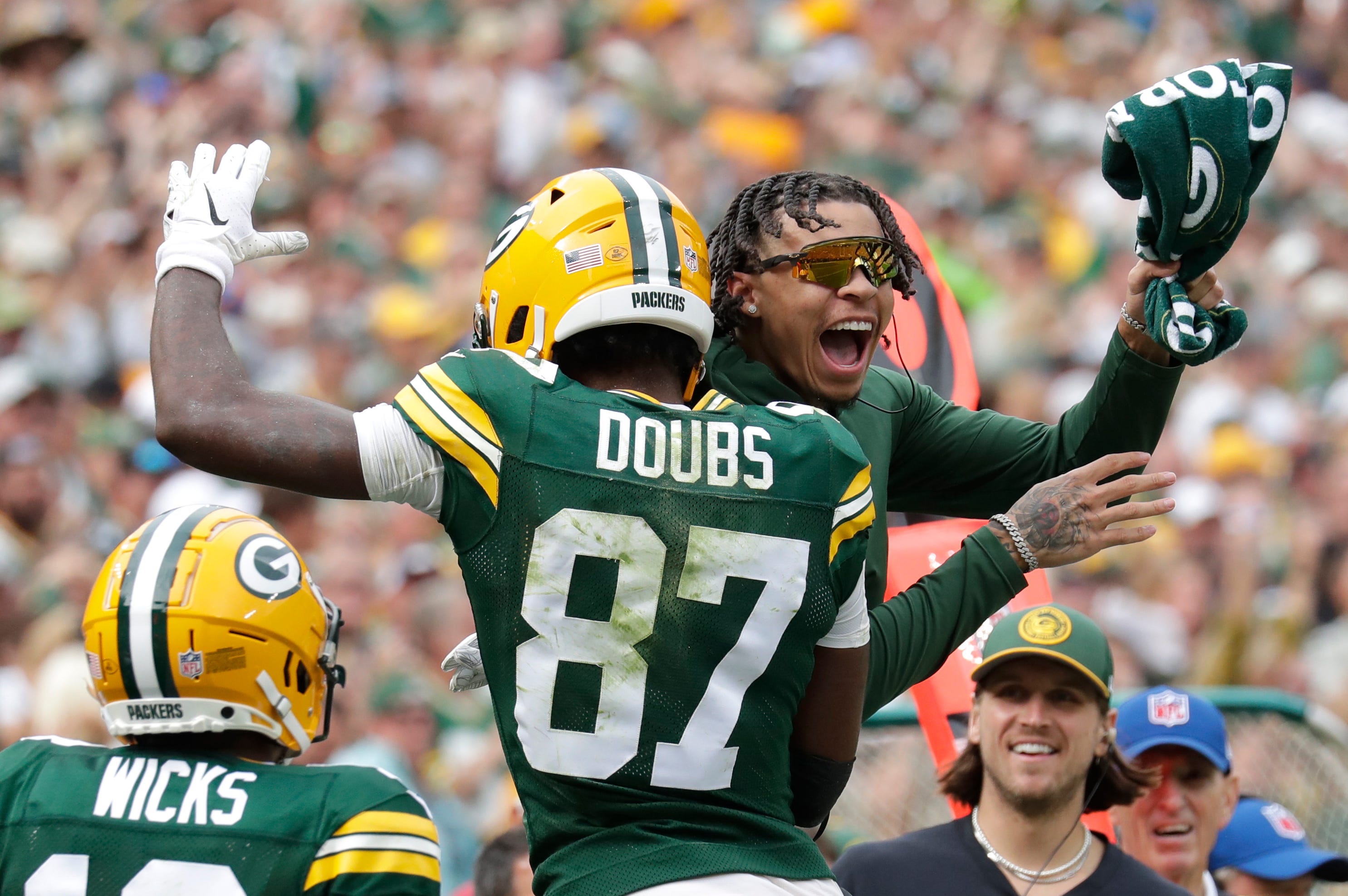 Green Bay Packers wide receiver Romeo Doubs (87) celebrates his fourth quarter touchdown with wide receiver Christian Watson against the New Orleans Saints in the fourth quarter during their football game Sunday, September 24, 2023, at Lambeau Field in Green Bay, Wis.