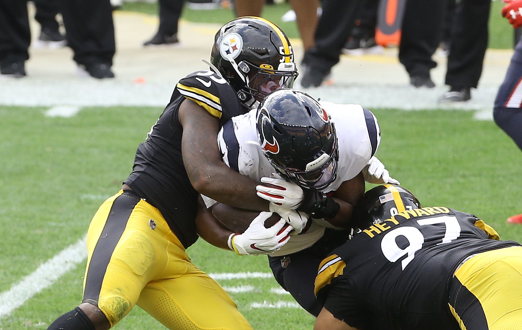 Sep 27, 2020; Pittsburgh, Pennsylvania, USA; Pittsburgh Steelers inside linebacker Devin Bush (55) and defensive end Cameron Heyward (97) tackle Houston Texans running back David Johnson (31) during the third quarter at Heinz Field. The Steelers won 28-21. Mandatory Credit: Charles LeClaire-USA TODAY Sports  