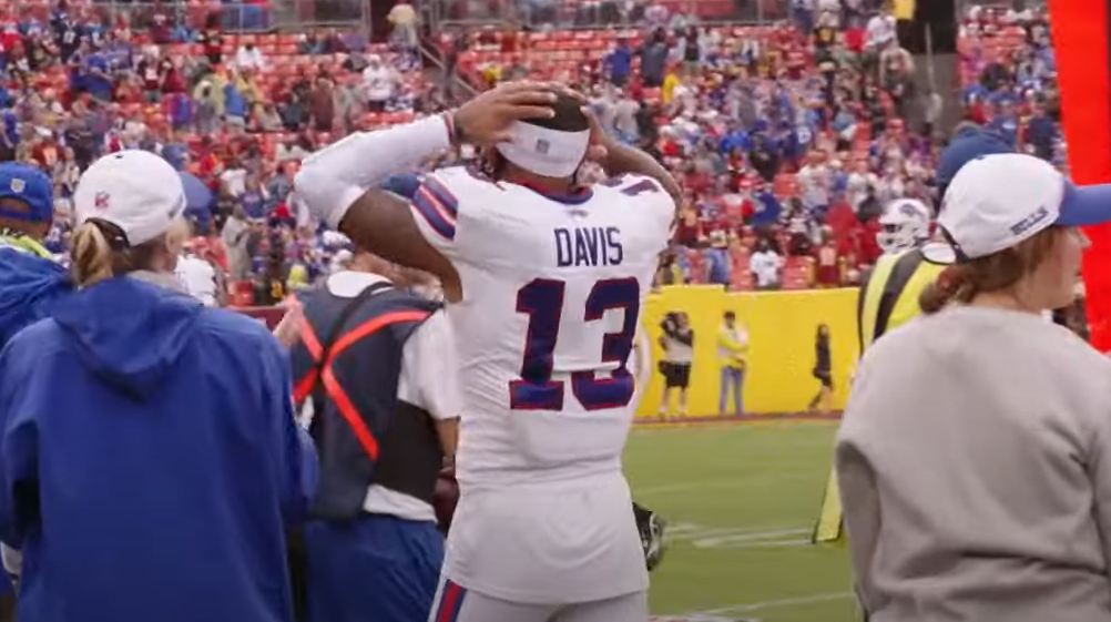 Buffalo Bills WR Gabe Davis celebrating a long run by his teammate James Cook in a game against the Washington Commanders