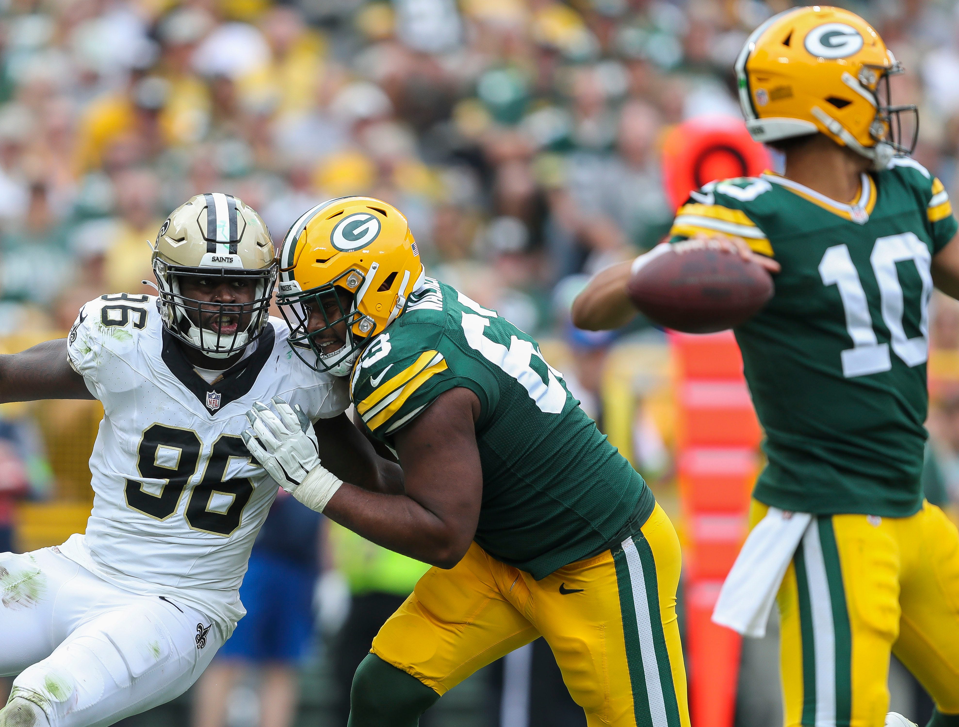Green Bay Packers offensive tackle Rasheed Walker (63) blocks New Orleans Saints defensive end Carl Granderson (96) on Sunday, September 24, 2023, at Lambeau Field in Green Bay, Wis. The Packers came back from a 17-0 fourth-quarter deficit to win the game, 18-17.