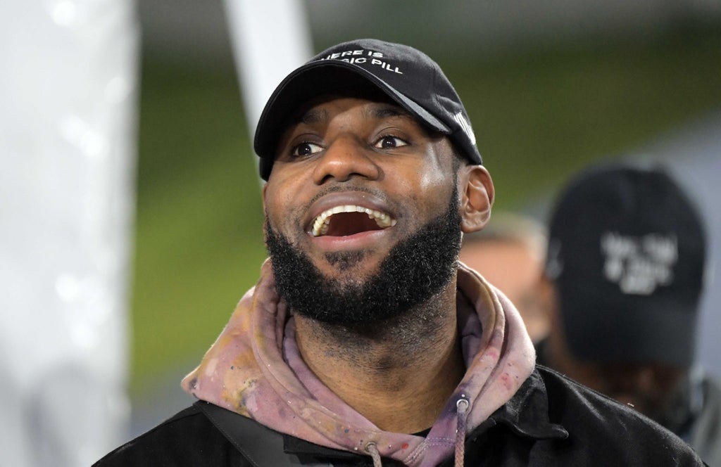 LeBron James of the LA Lakers attends the game between the Los Angeles Rams and the Dallas Cowboys in a NFC Divisional playoff football game at Los Angeles Memorial Coliseum.