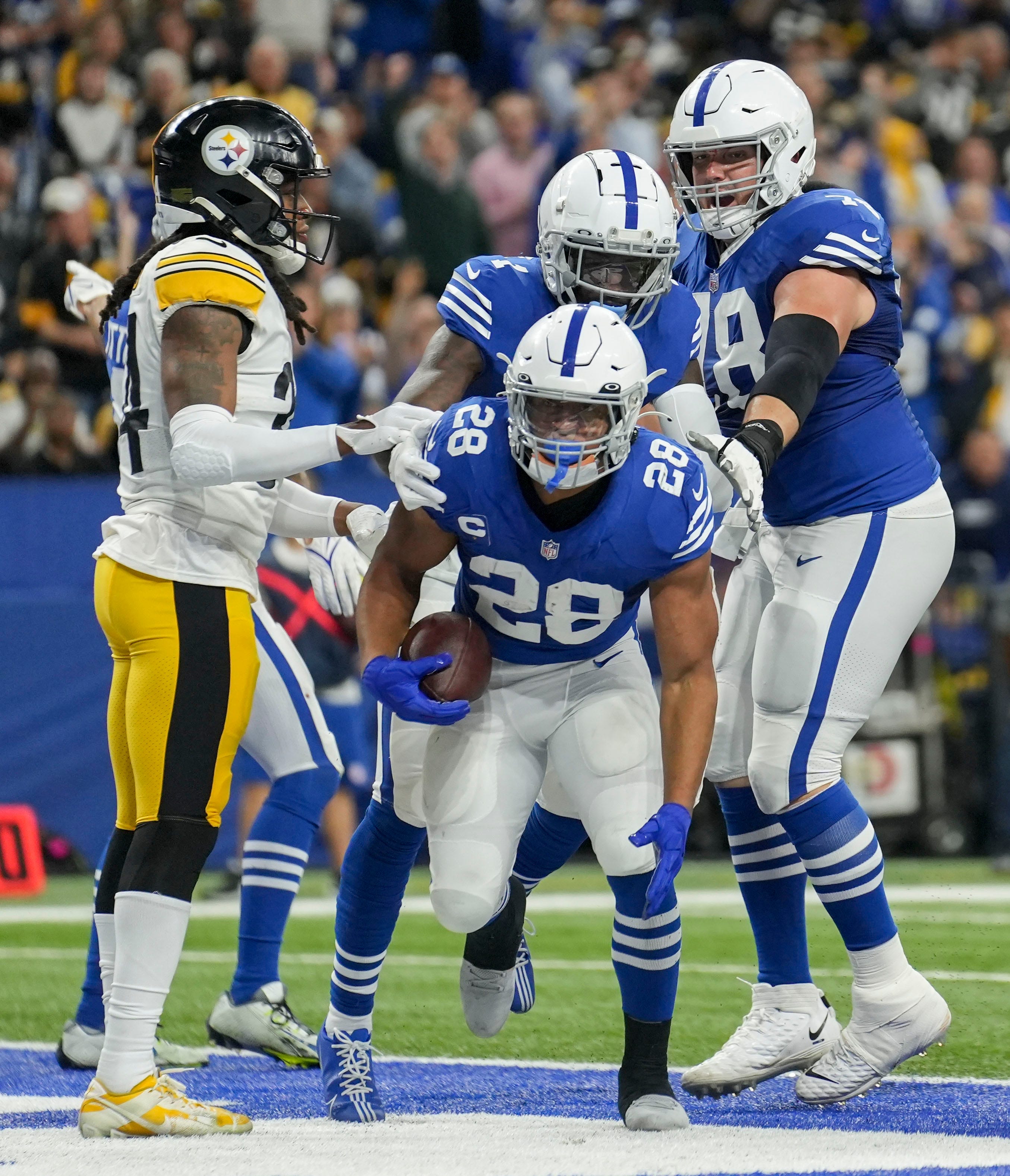 Indianapolis Colts running back Jonathan Taylor (28) celebrates after scoring a touchdown Monday, Nov. 28, 2022, during a game against the Pittsburgh Steelers at Lucas Oil Stadium in Indianapolis.