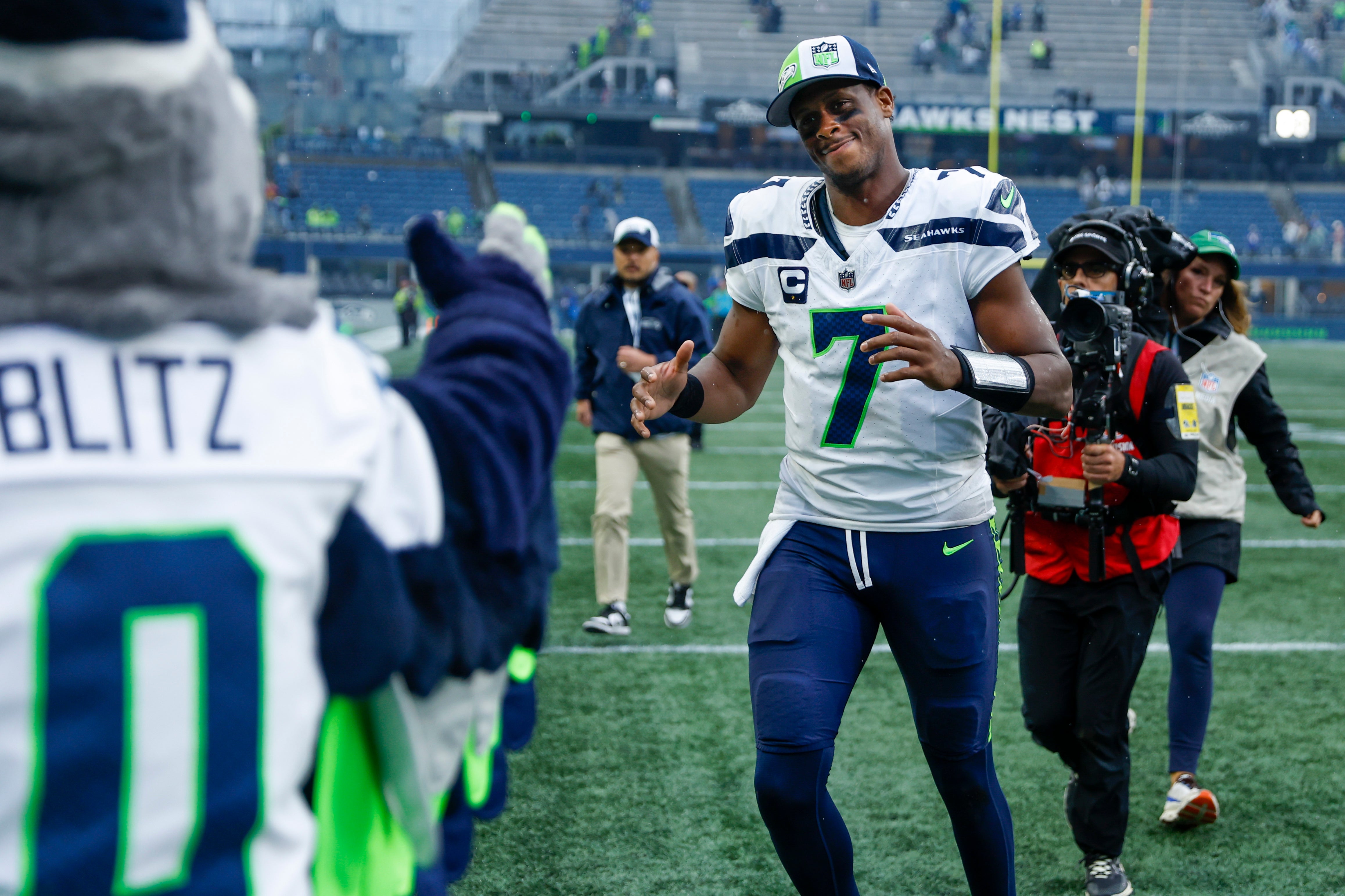 Sep 24, 2023; Seattle, Washington, USA; Seattle Seahawks quarterback Geno Smith (7) returns to the locker room following a 37-27 Seattle victory against the Carolina Panthers at Lumen Field. Mandatory Credit: Joe Nicholson-USA TODAY Sports