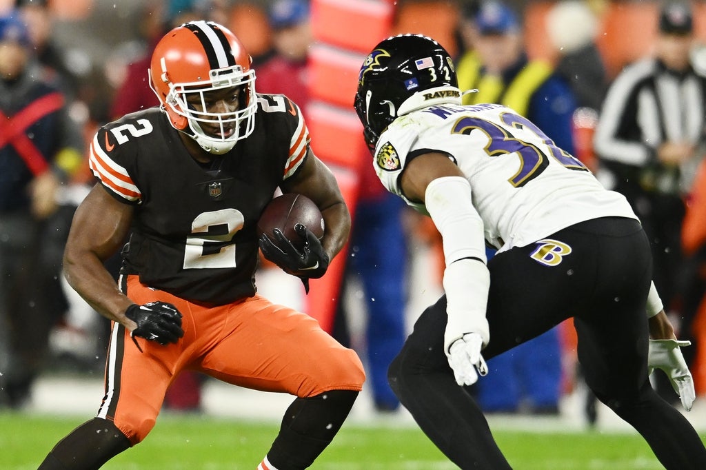Cleveland Browns wide receiver Amari Cooper (2) runs with the ball after a catch as Baltimore Ravens safety Marcus Williams (32) defends during the second half at FirstEnergy Stadium.