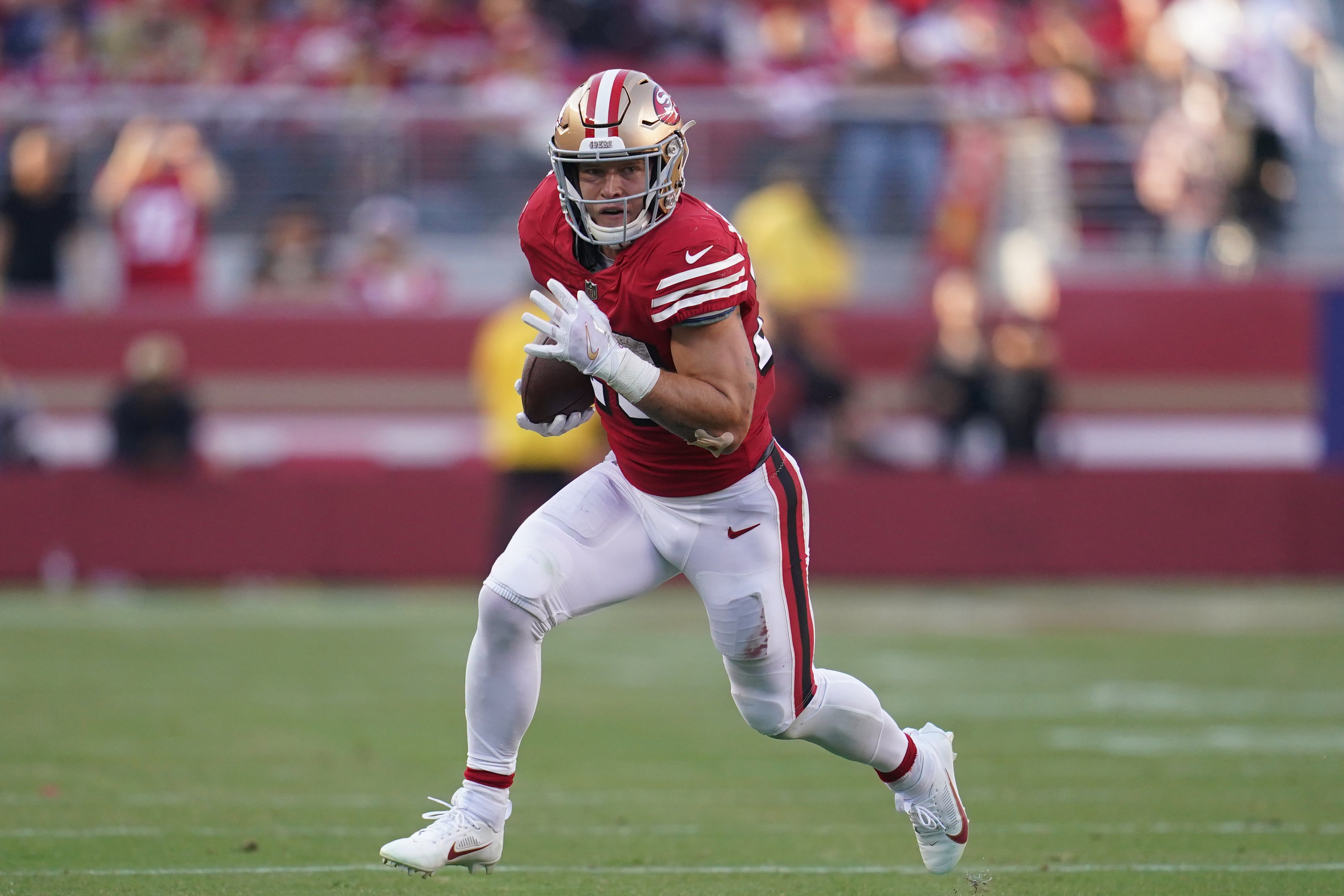 Sep 21, 2023; Santa Clara, California, USA; San Francisco 49ers running back Christian McCaffrey (23) runs the ball against the New York Giants in the second quarter at Levi's Stadium.