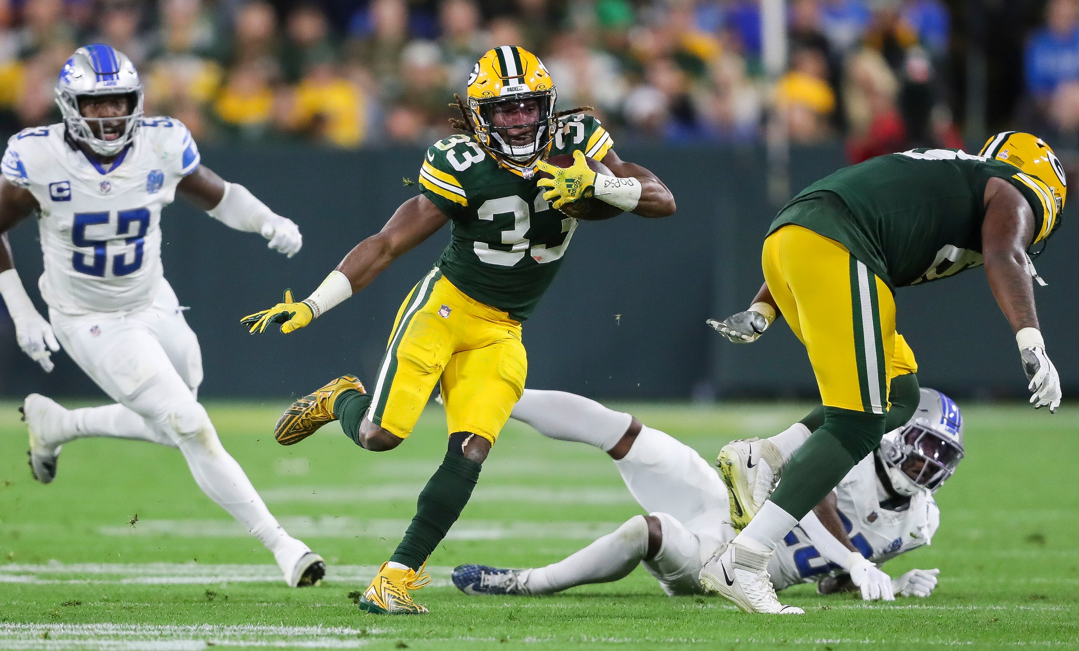 Sep 28, 2023; Green Bay, Wisconsin, USA; Green Bay Packers running back Aaron Jones (33) runs the ball against the Detroit Lions during their football game on Thursday, September 28, 2023, at Lambeau Field in Green Bay, Wis. The Lions won the game, 34-20.