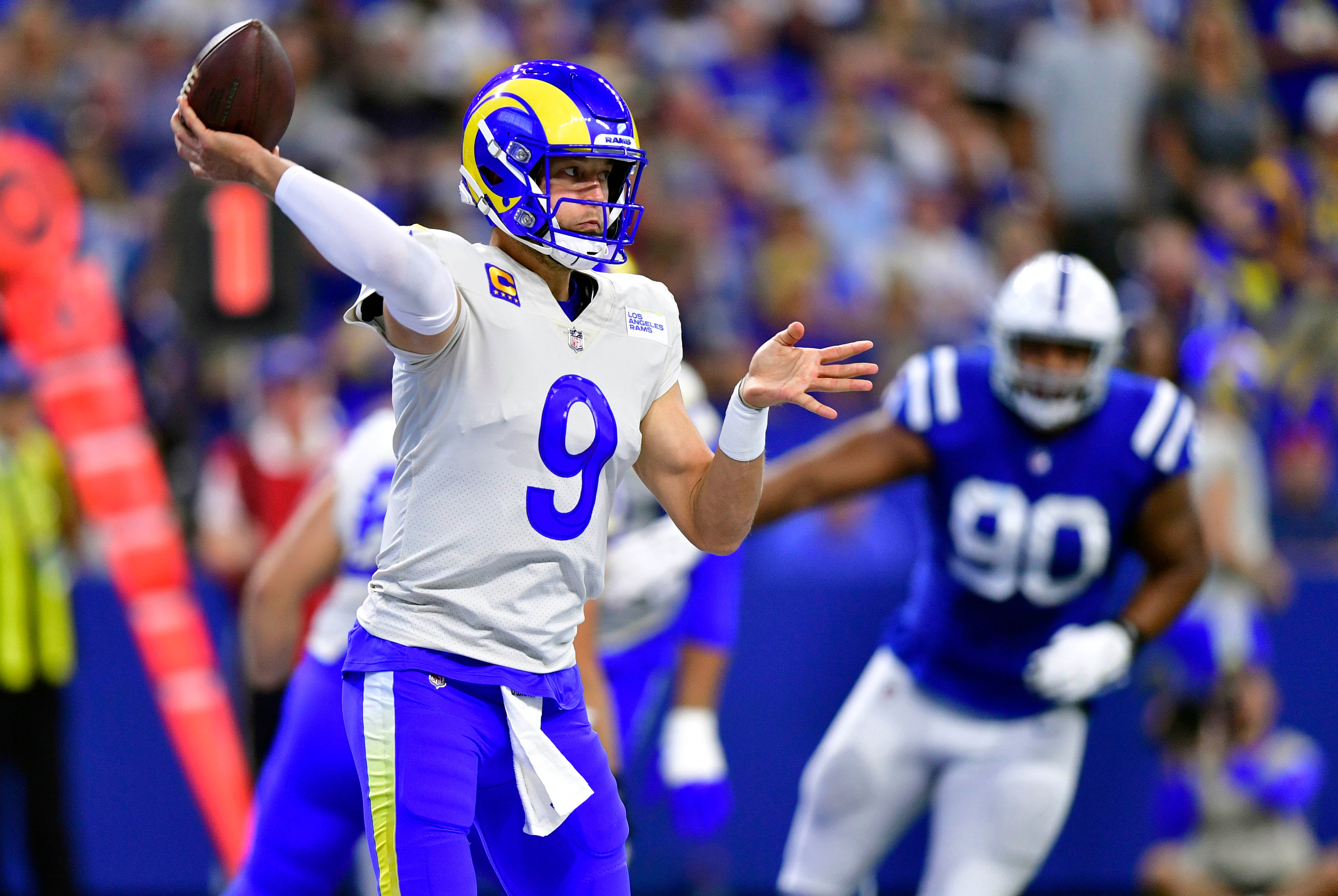 Sep 19, 2021; Indianapolis, Indiana, USA; Los Angeles Rams quarterback Matthew Stafford (9) throws a pass during the second quarter against the Indianapolis Colts at Lucas Oil Stadium.