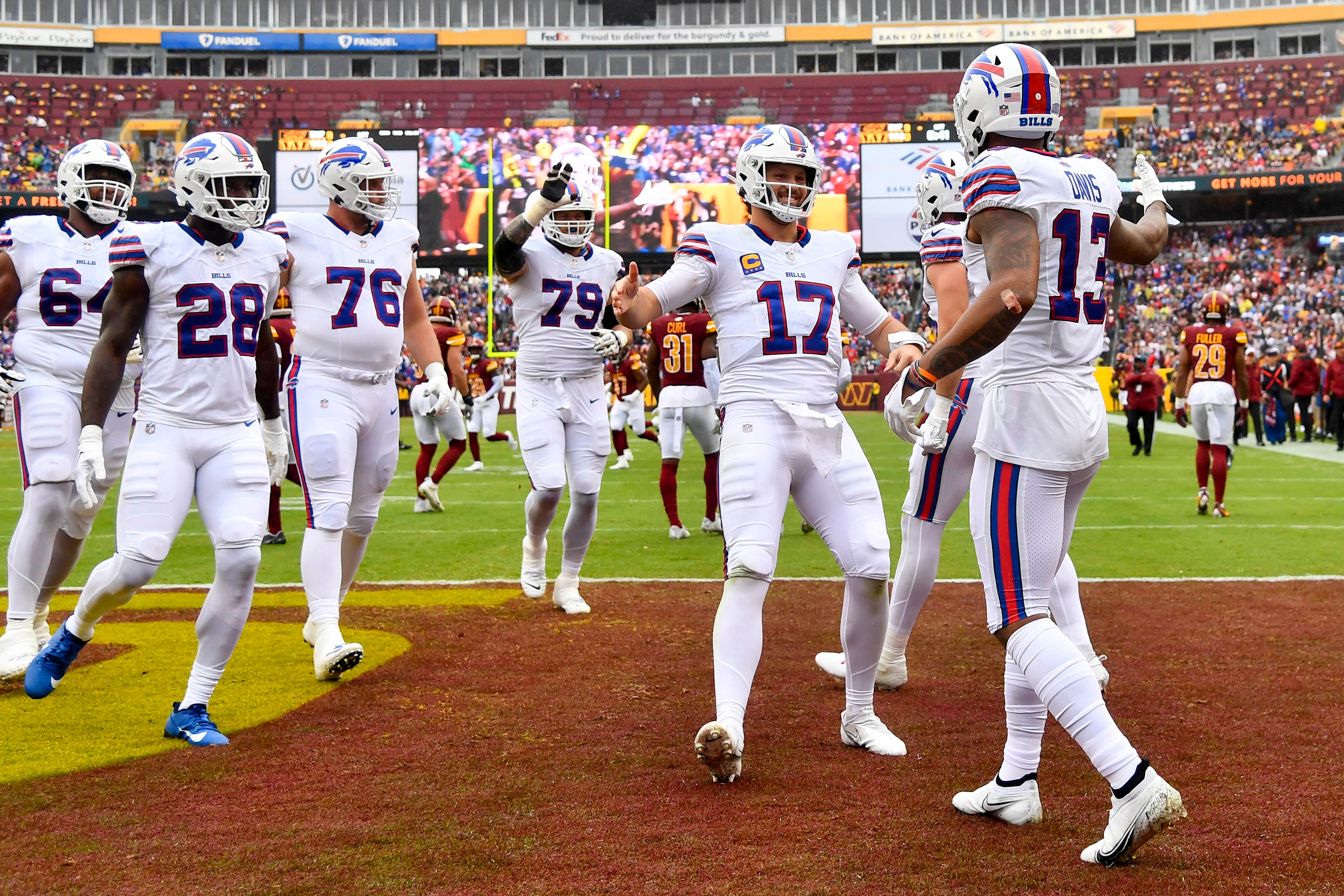 Buffalo Bills QB Josh Allen celebrating a touchdown with WR Gabe Davis against the Washington Commanders