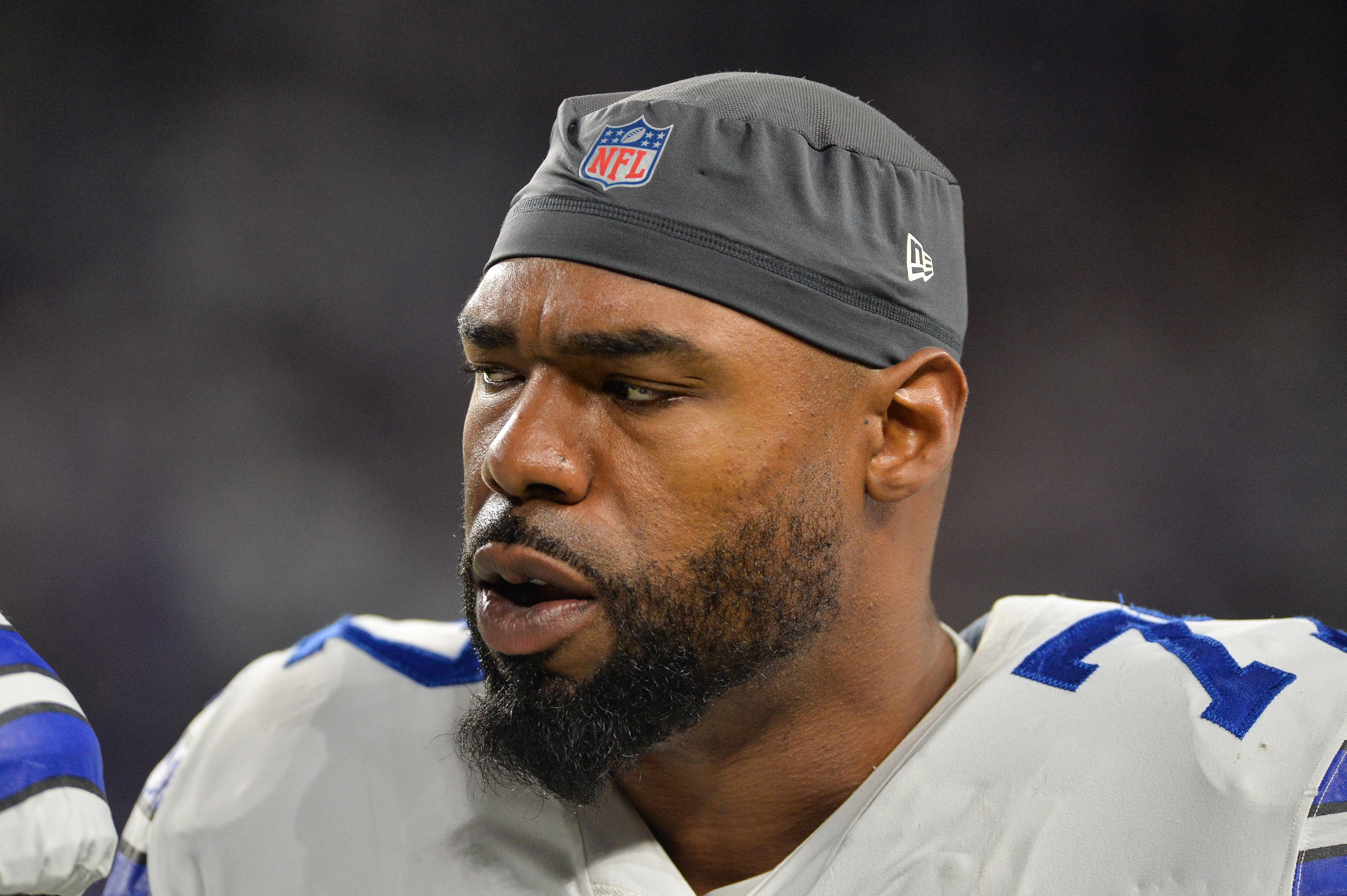 USA; Dallas Cowboys offensive tackle Tyron Smith (77) looks on during the game against the Minnesota Vikings at U.S. Bank Stadium. Mandatory Credit: Jeffrey Becker-USA TODAY Sports