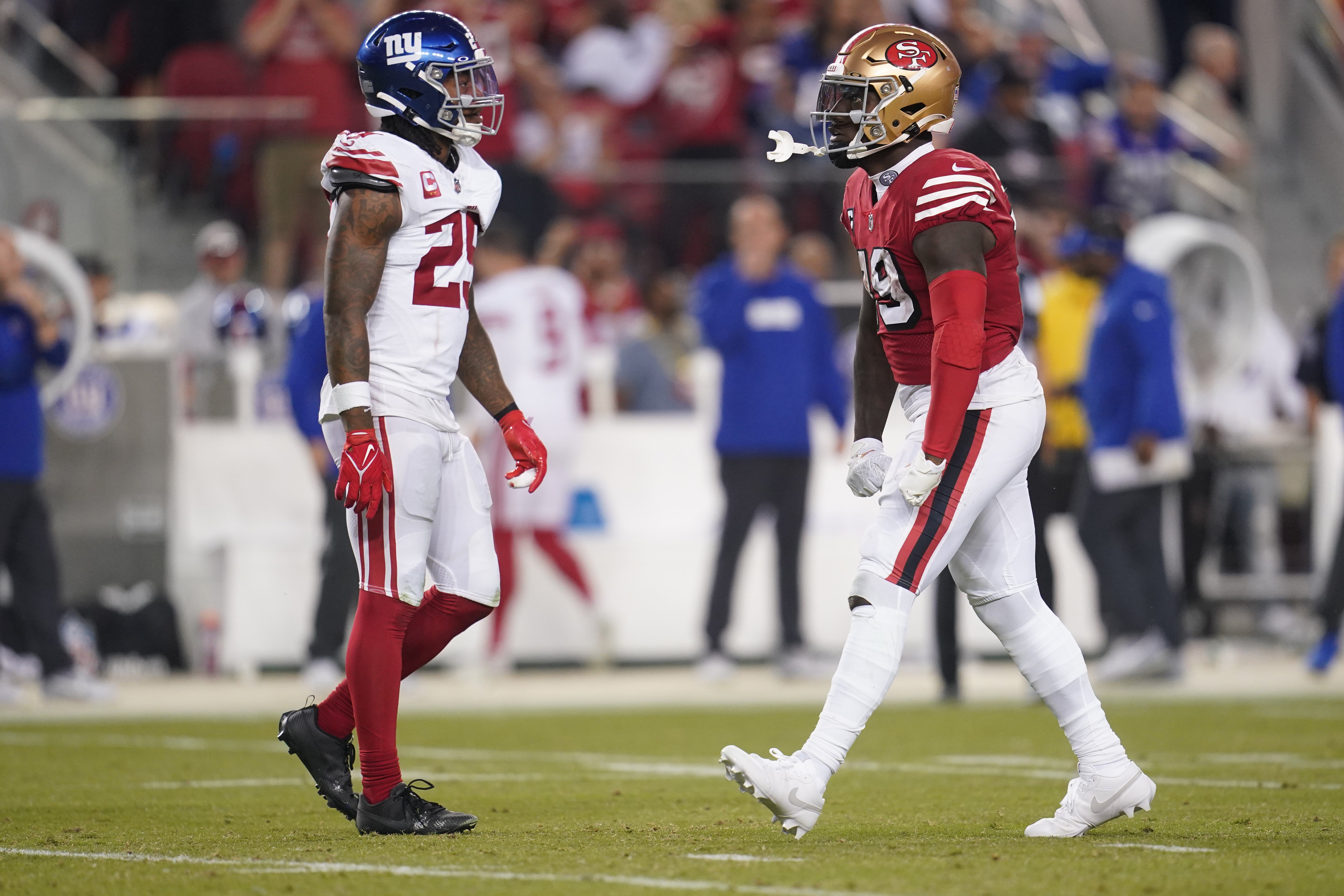 Sep 21, 2023; Santa Clara, California, USA; San Francisco 49ers wide receiver Deebo Samuel (19) reacts next to New York Giants safety Xavier McKinney (29) after making a catch for a first down in the third quarter at Levi's Stadium.