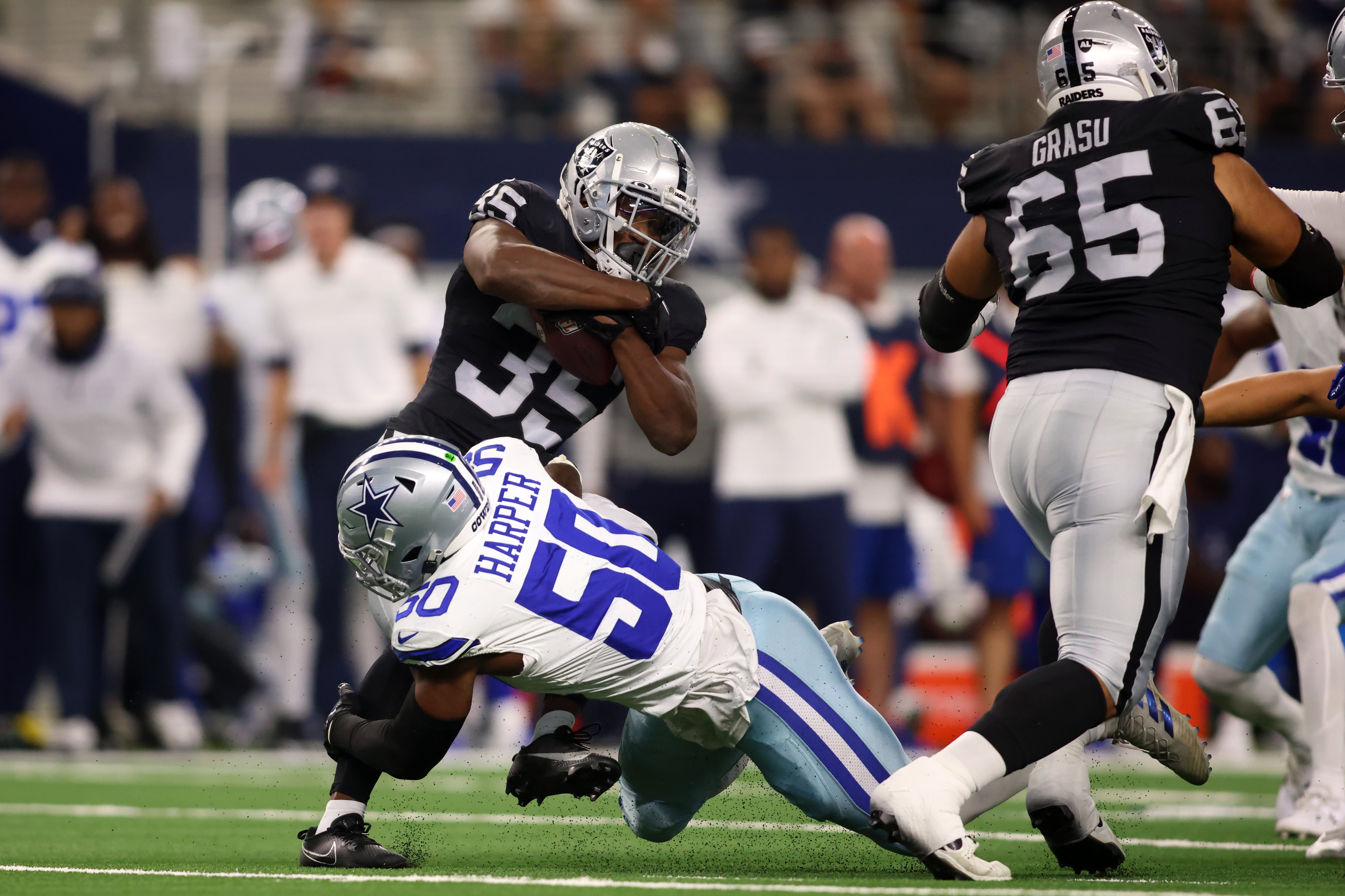 Former Dallas Cowboys LB Devin Harper goes in for a tackle