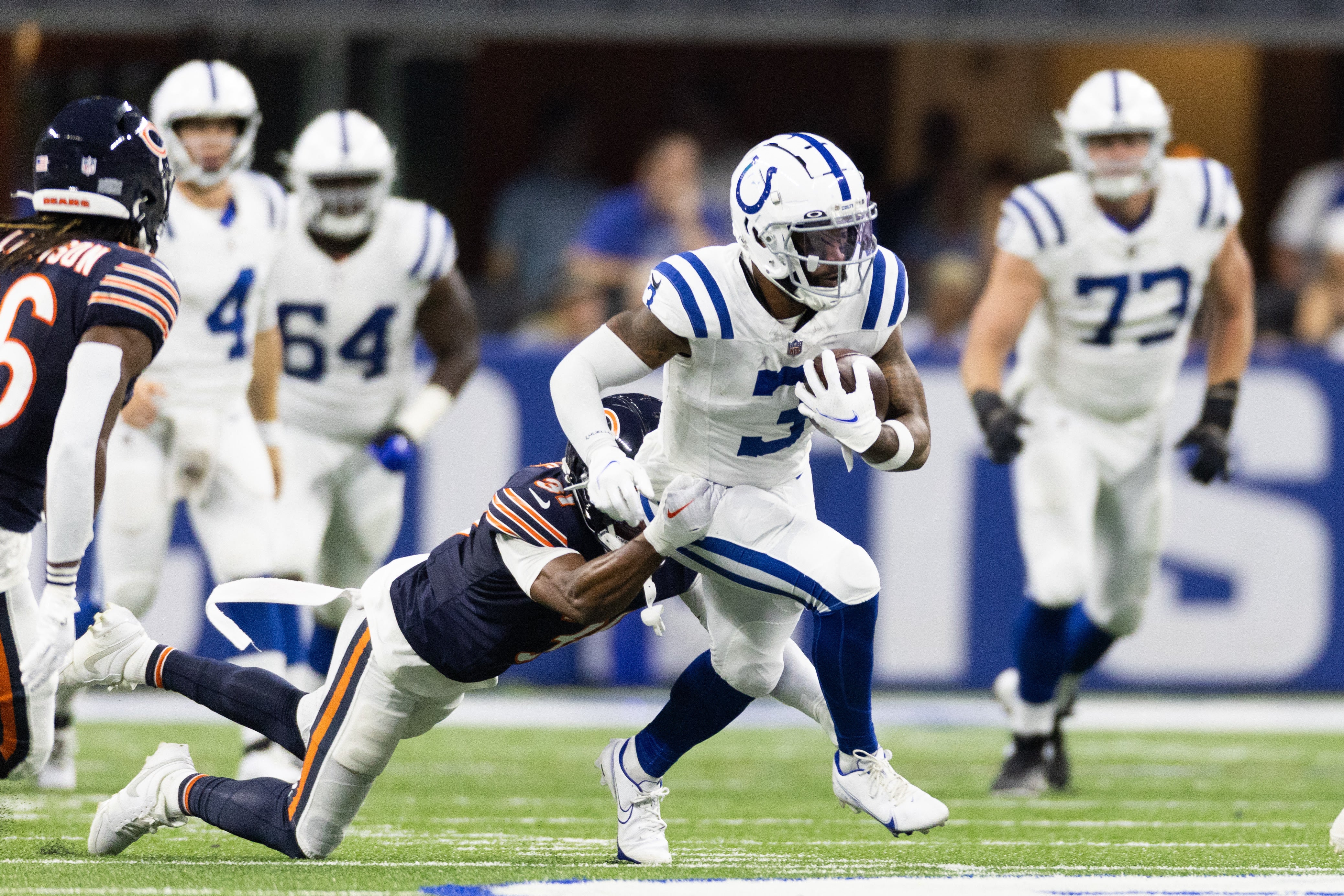Aug 19, 2023; Indianapolis, Indiana, USA; Indianapolis Colts wide receiver Amari Rodgers (3) runs the ball while Chicago Bears defensive end Yannick Ngakoue (91) defends in the second half at Lucas Oil Stadium.