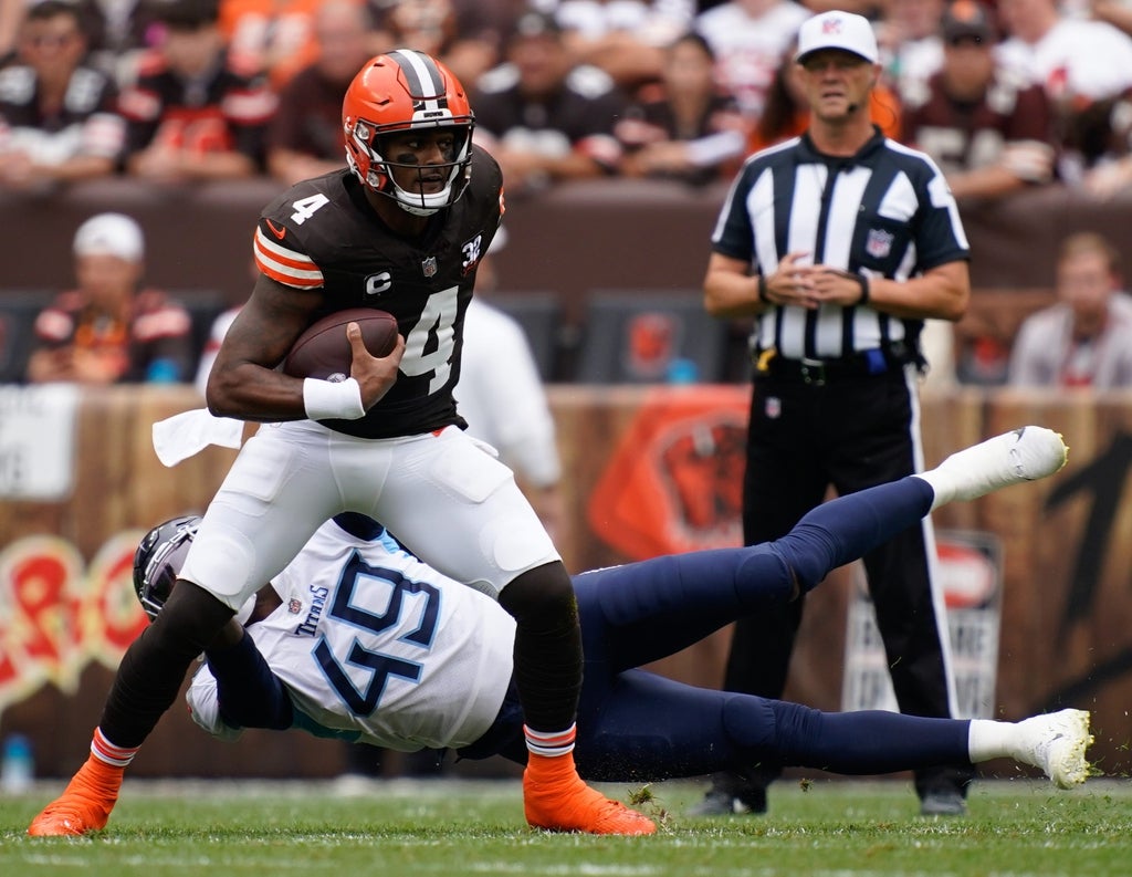 Cleveland Browns quarterback Deshaun Watson (4) gets away from Tennessee Titans linebacker Arden Key (49) during the first quarter in Cleveland, Ohio, Sunday, Sept. 24, 2023
