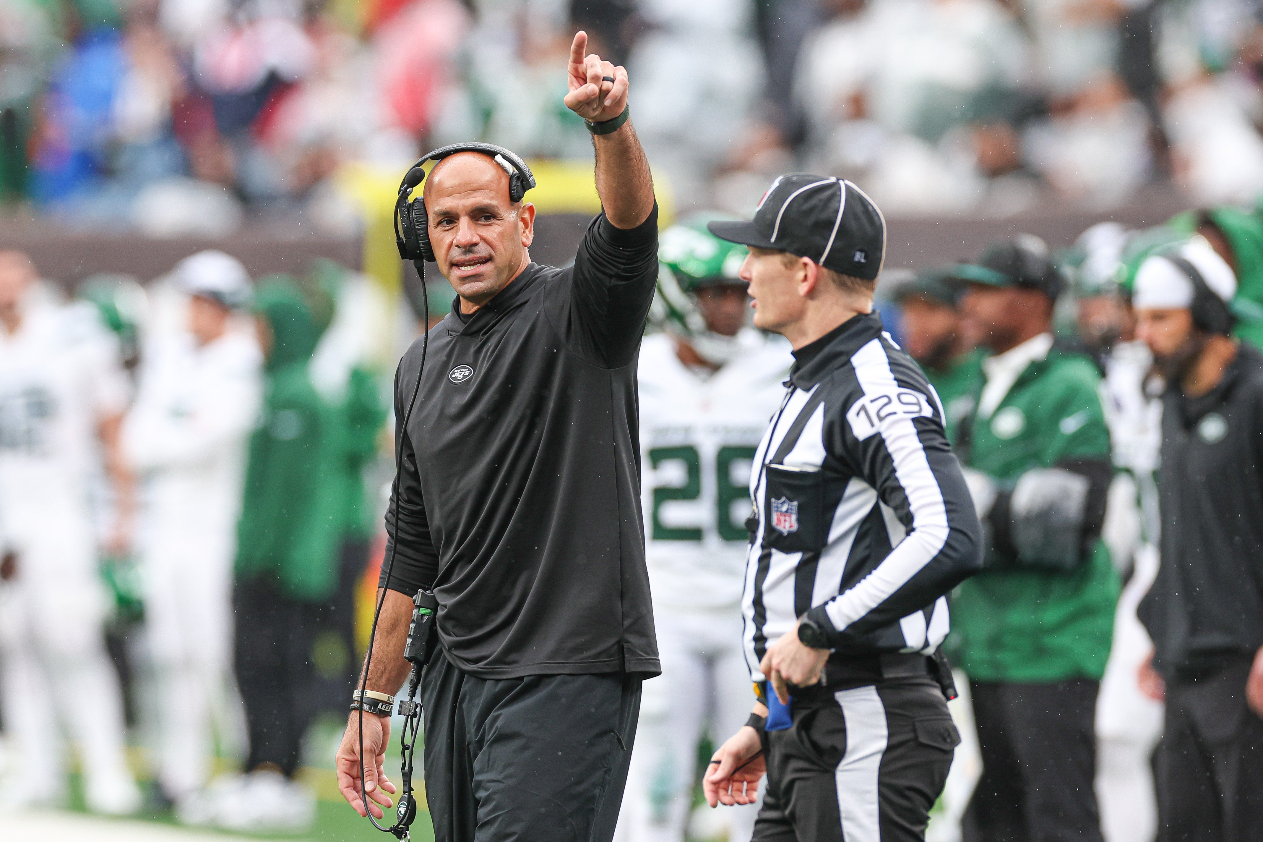 New York Jets head coach Robert Saleh points to the game clock in front of down judge Dale Keller (129) during the second half against the New England Patriots at MetLife Stadium. Mandatory Credit: Vincent Carchietta-USA TODAY Sports