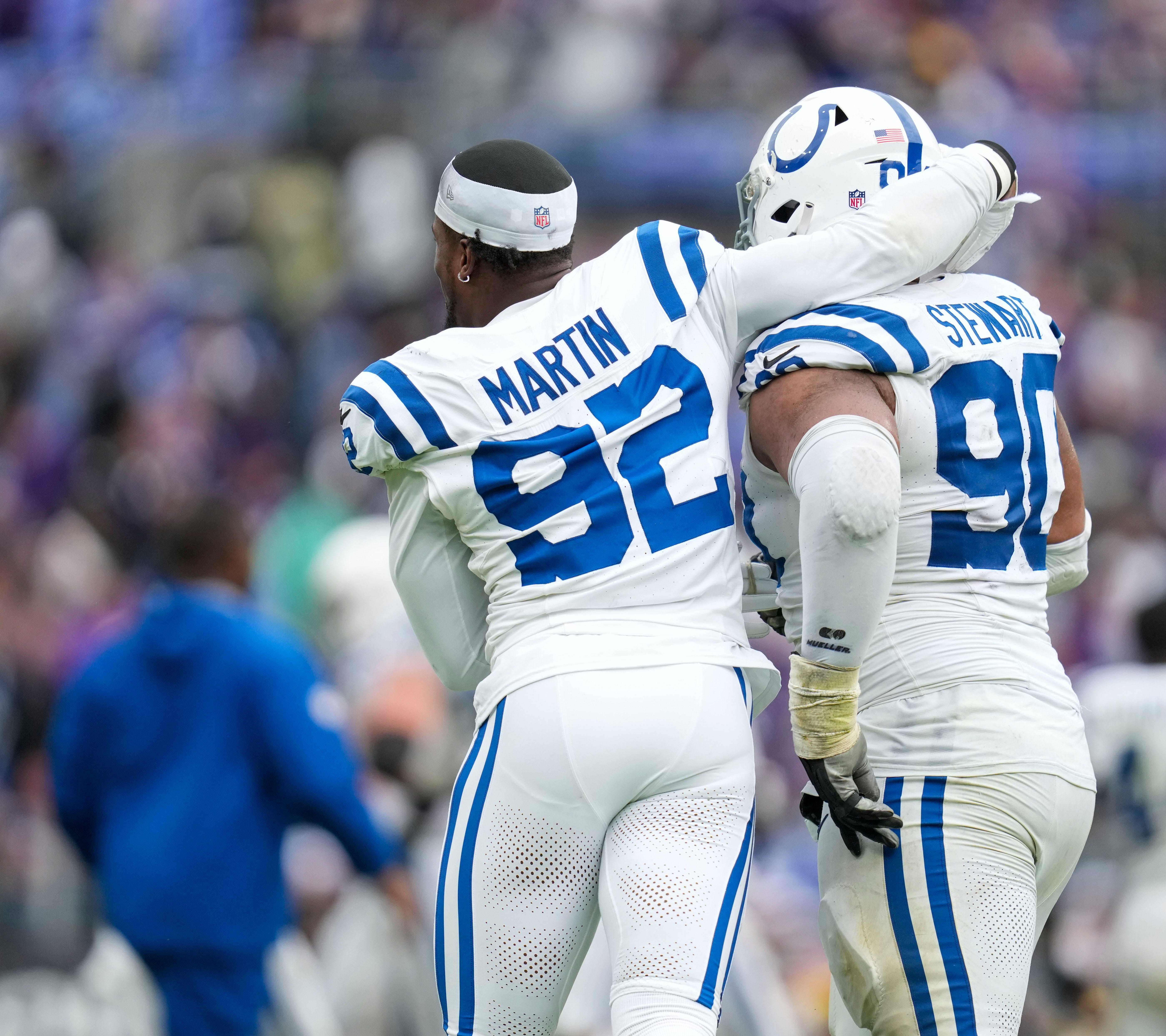 Indianapolis Colts defensive end Jake Martin (92) and teammate Indianapolis Colts defensive tackle Grover Stewart (90) celebrate after the win over the Baltimore Ravens on Sunday, Sept. 24, 2023, at M&T Bank Stadium in Baltimore.