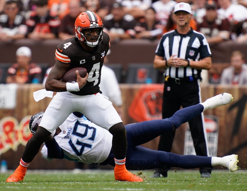 Cleveland Browns quarterback Deshaun Watson (4) gets away from Tennessee Titans linebacker Arden Key (49) during the first quarter in Cleveland, Ohio., Sunday, Sept. 24, 2023.