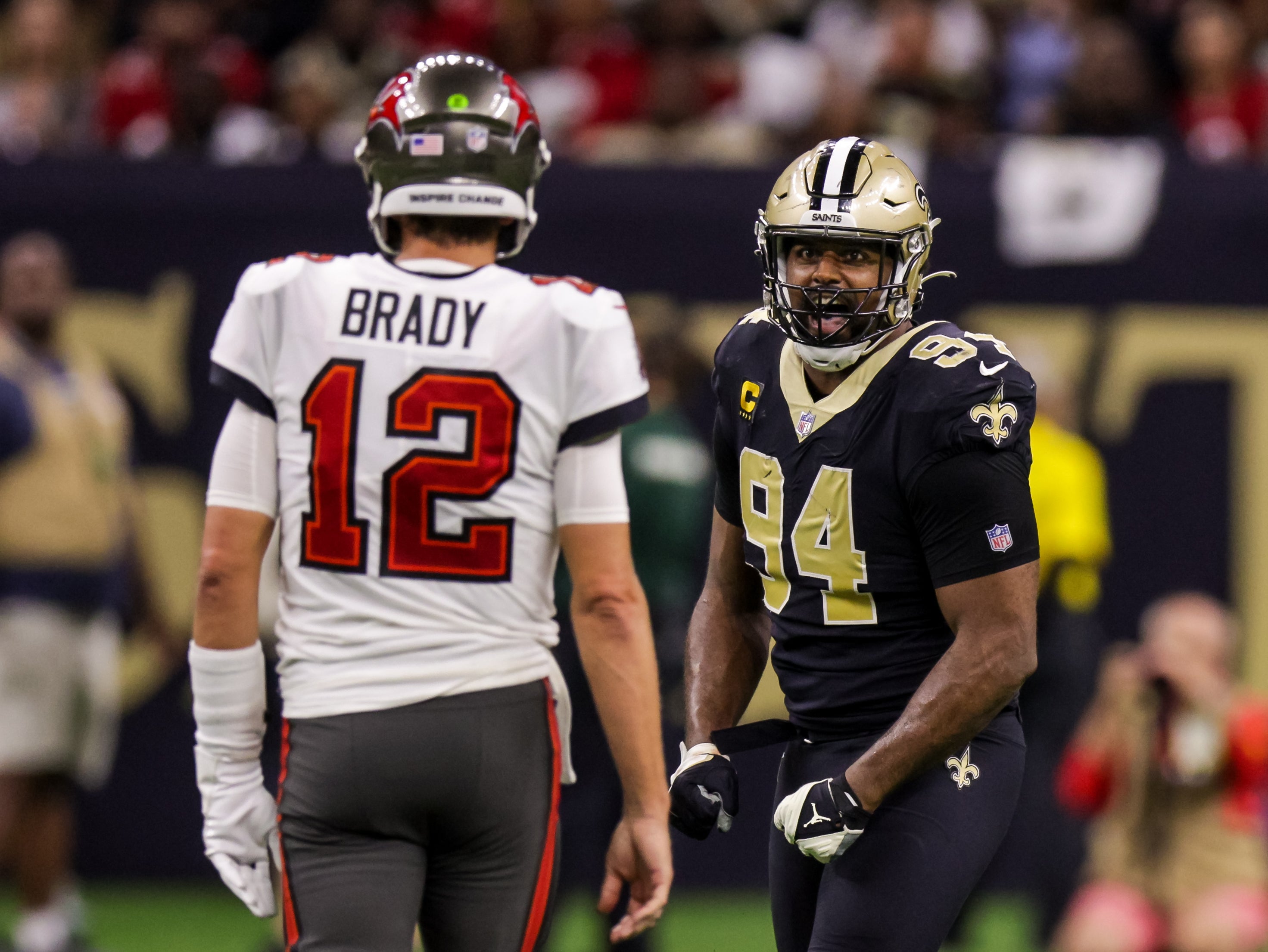 Sep 18, 2022; New Orleans, Louisiana, USA; New Orleans Saints defensive end Cameron Jordan (94) stares at Tampa Bay Buccaneers quarterback Tom Brady (12) and reacts to a play during the second half at Caesars Superdome. Mandatory Credit: Stephen Lew-USA TODAY Sports