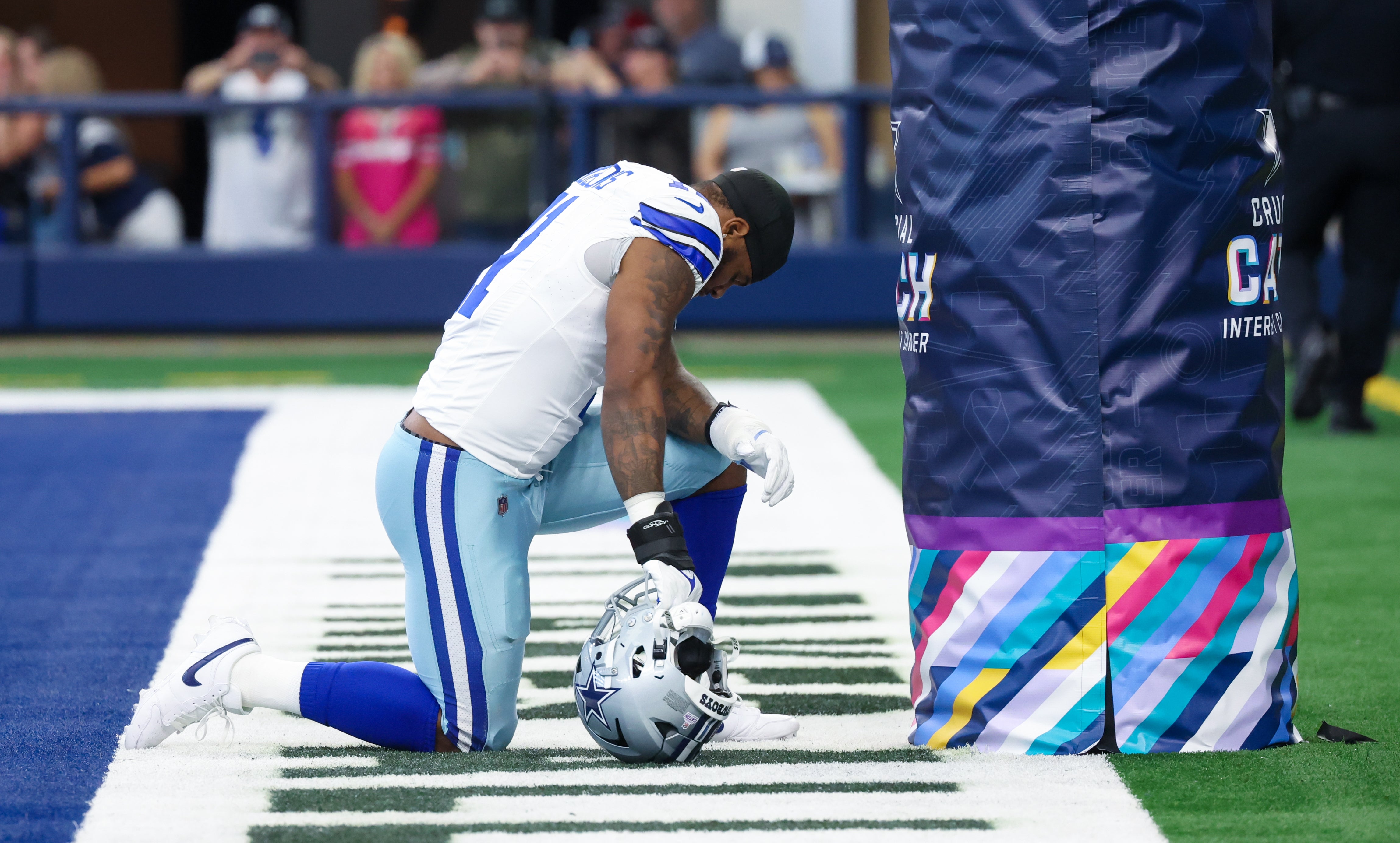 Dallas Cowboys linebacker Micah Parsons (11) prays before the game against the New England Patriots at AT&T Stadium. Mandatory Credit: Kevin Jairaj-USA TODAY Sports