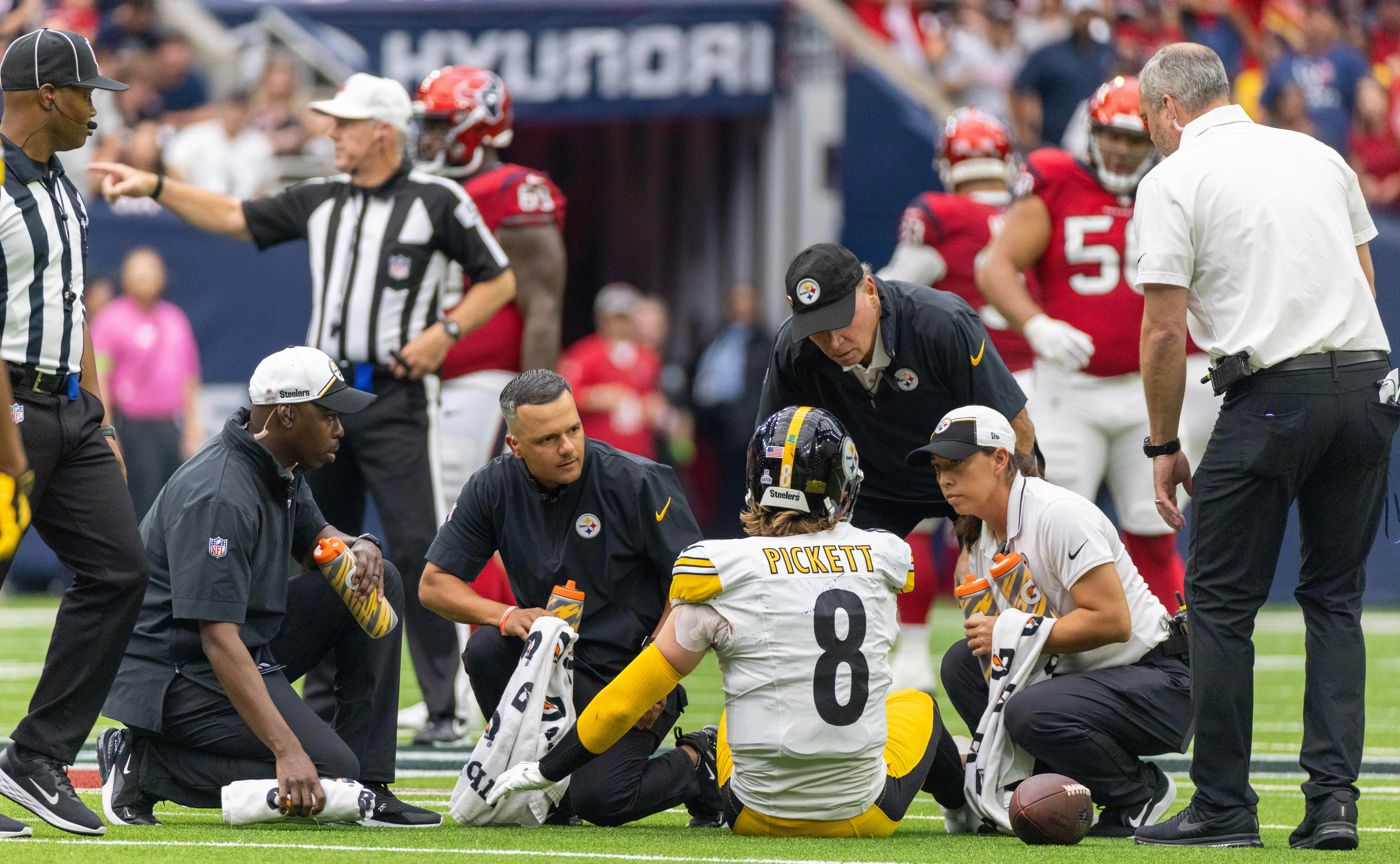 Oct 1, 2023; Houston, Texas, USA; Pittsburgh Steelers quarterback Kenny Pickett (8) is attended after being in cured when he got sacked against the Houston Texans in the second half at NRG Stadium. Mandatory Credit: Thomas Shea-USA TODAY Sports