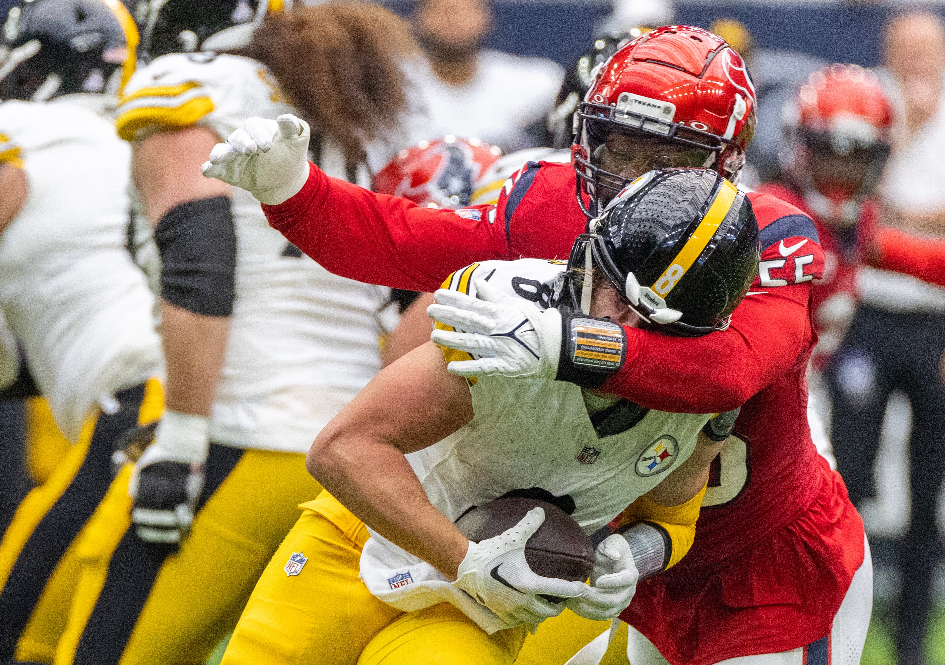 Oct 1, 2023; Houston, Texas, USA; Pittsburgh Steelers quarterback Kenny Pickett (8) is sacked by Houston Texans defensive end Jerry Hughes (55) in the first quarter at NRG Stadium. Mandatory Credit: Thomas Shea-USA TODAY Sports
