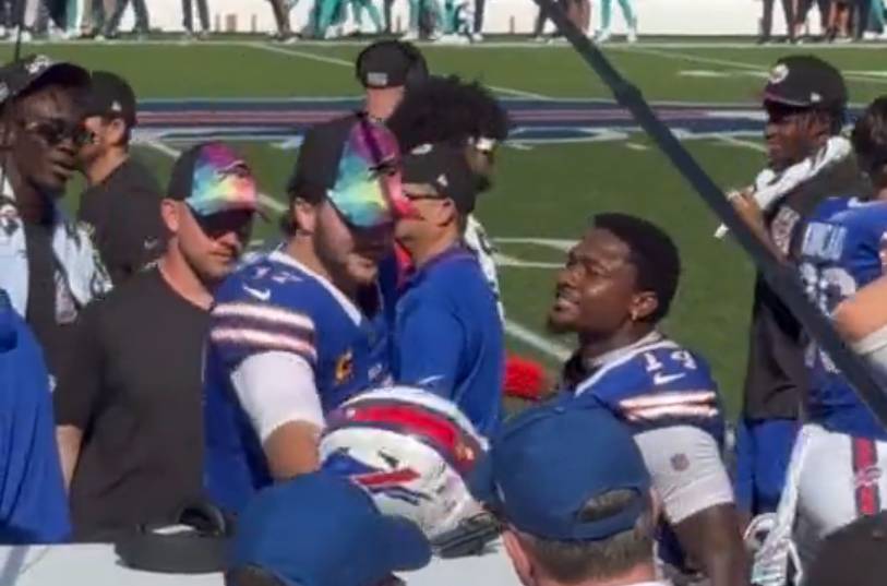 Buffalo Bills QB Josh Allen and WR Stefon Diggs celebrate on the sideline during the Bills victory over the Miami Dolphins