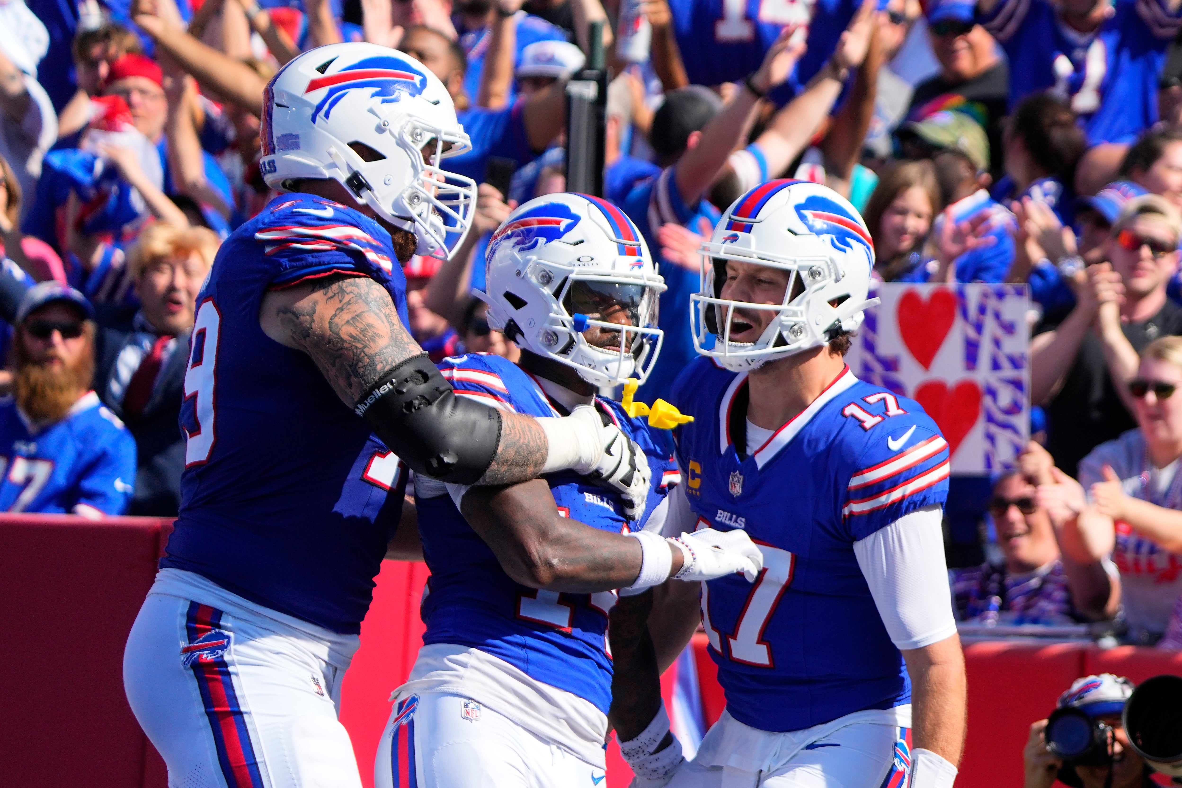 Buffalo Bills WR Stefon Diggs celebrating with QB Josh Allen in the endzone during their victory over the Miami Dolphins