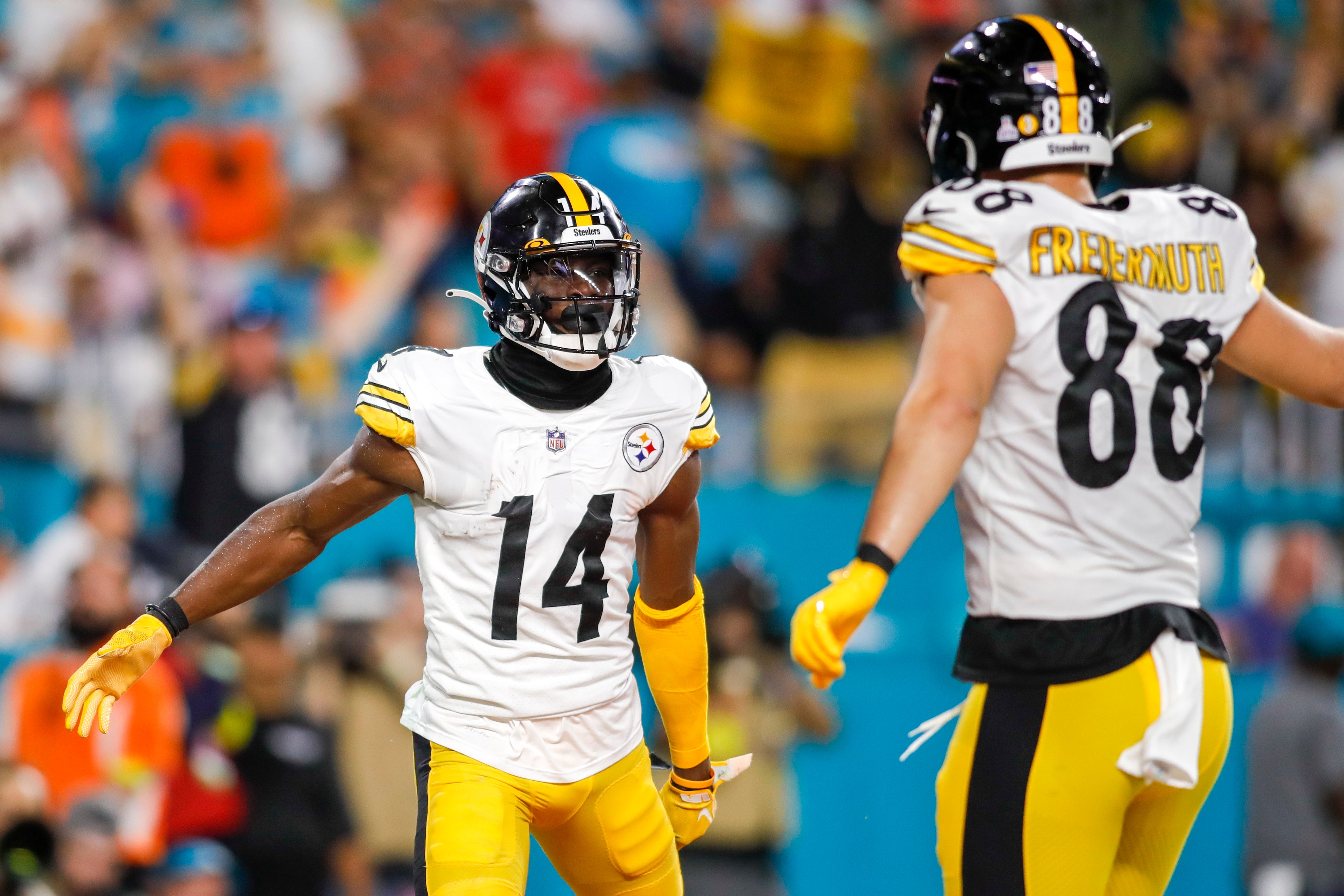 Oct 23, 2022; Miami Gardens, Florida, USA; Pittsburgh Steelers wide receiver George Pickens (14) celebrates with tight end Pat Freiermuth (88) after scoring a touchdown during the second quarter against the Miami Dolphins at Hard Rock Stadium. Mandatory Credit: Sam Navarro-USA TODAY Sports  