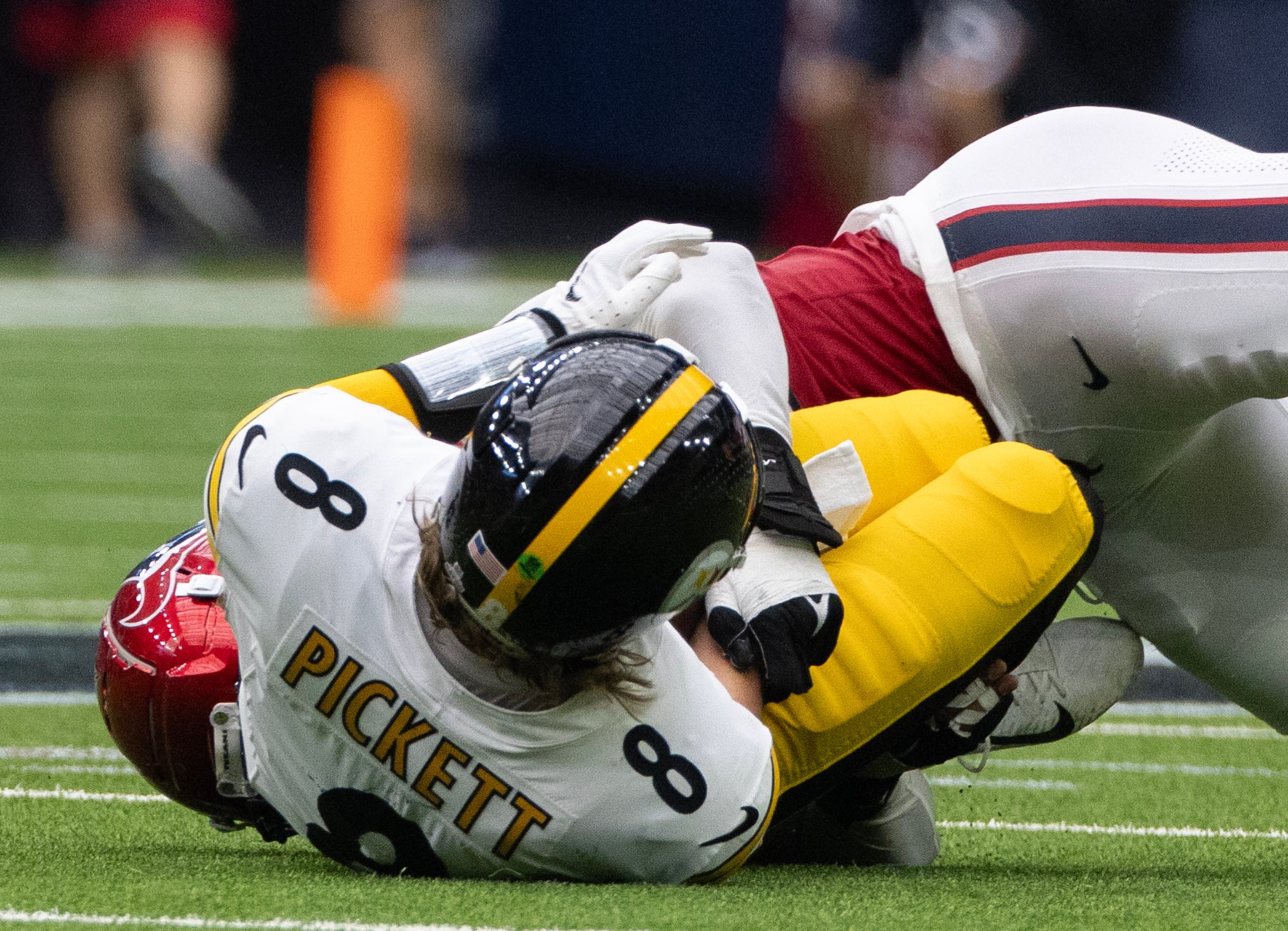 Oct 1, 2023; Houston, Texas, USA; Pittsburgh Steelers quarterback Kenny Pickett (8) is injured as he is sacked by Houston Texans defensive end Jonathan Greenard (52) in the second half at NRG Stadium. Mandatory Credit: Thomas Shea-USA TODAY Sports