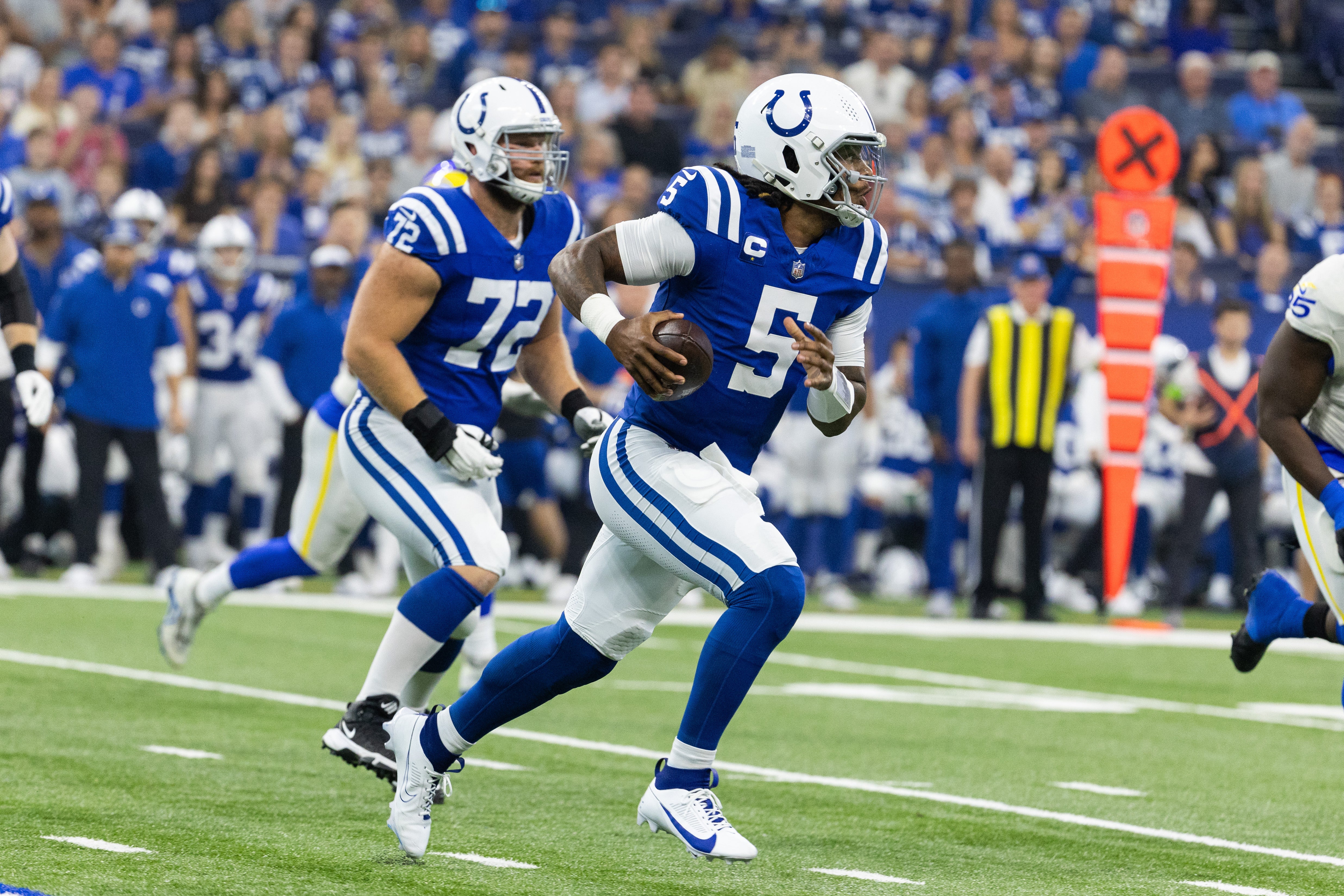 Oct 1, 2023; Indianapolis, Indiana, USA; Indianapolis Colts quarterback Anthony Richardson (5) runs the ball in the first quarter against the Los Angeles Rams at Lucas Oil Stadium.