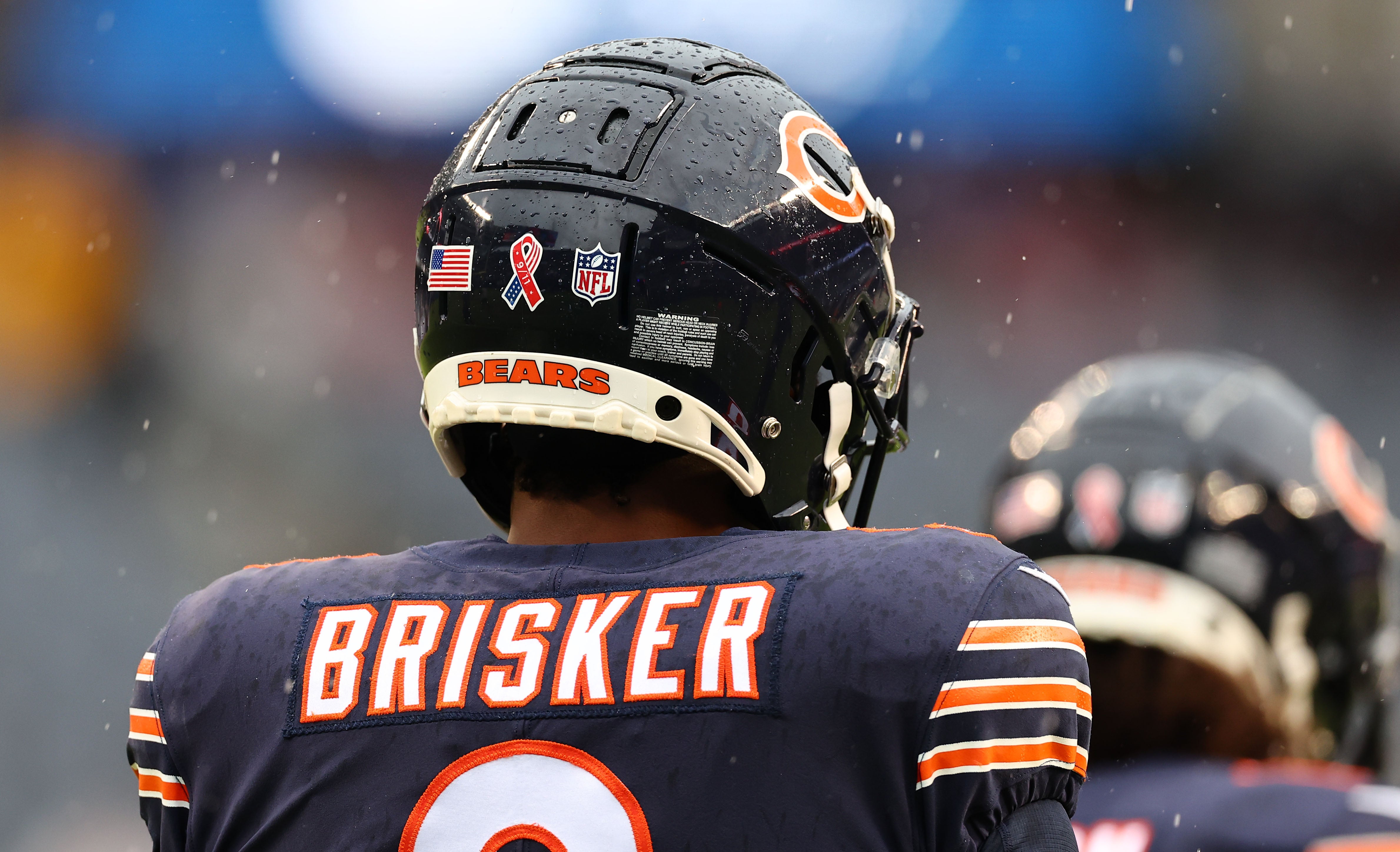 Sep 11, 2022; Chicago, Illinois, USA; Chicago Bears safety Jaquan Brisker (9) and the Chicago Bears wear special decals to honor the 21st. anniversary of 9/11 before the game at Soldier Field.