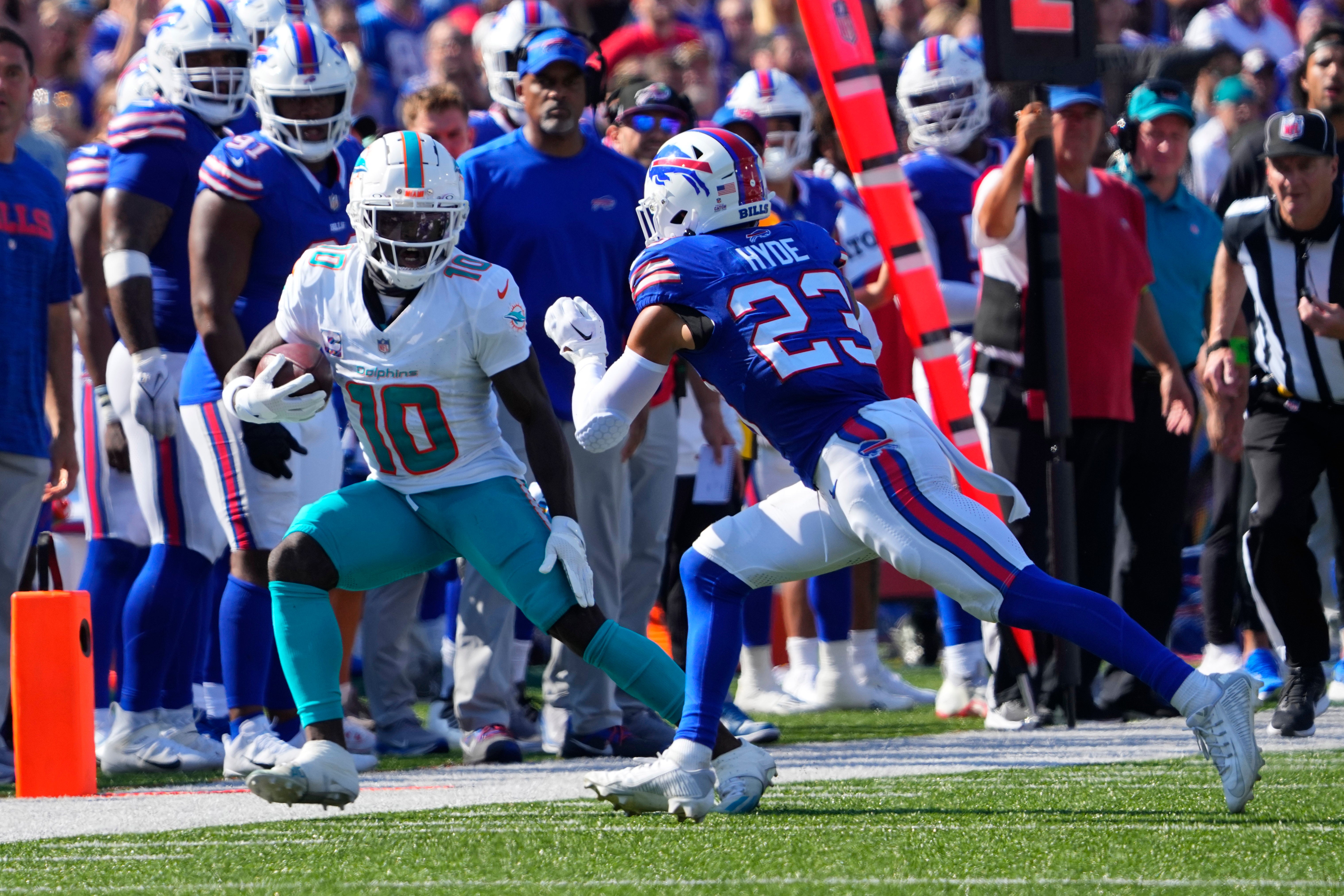 Miami Dolphins WR Tyreek Hill stepping out of bounds with Buffalo Bills S Micah Hyde ready to make the tackle