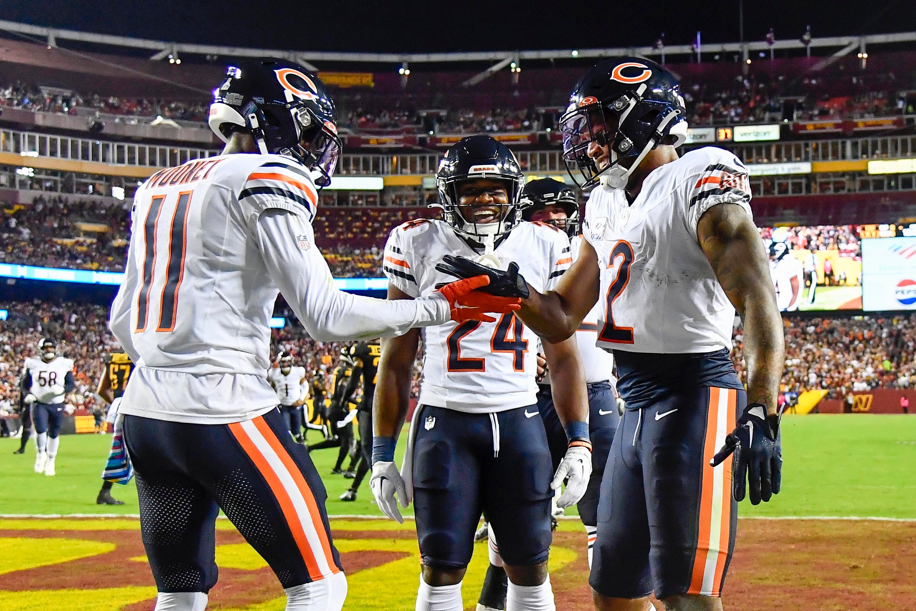 Oct 5, 2023; Landover, Maryland, USA; Chicago Bears wide receiver DJ Moore (2) celebrates with wide receiver Darnell Mooney (11) after scoring a touchdown against the Washington Commanders during the first half at FedExField.