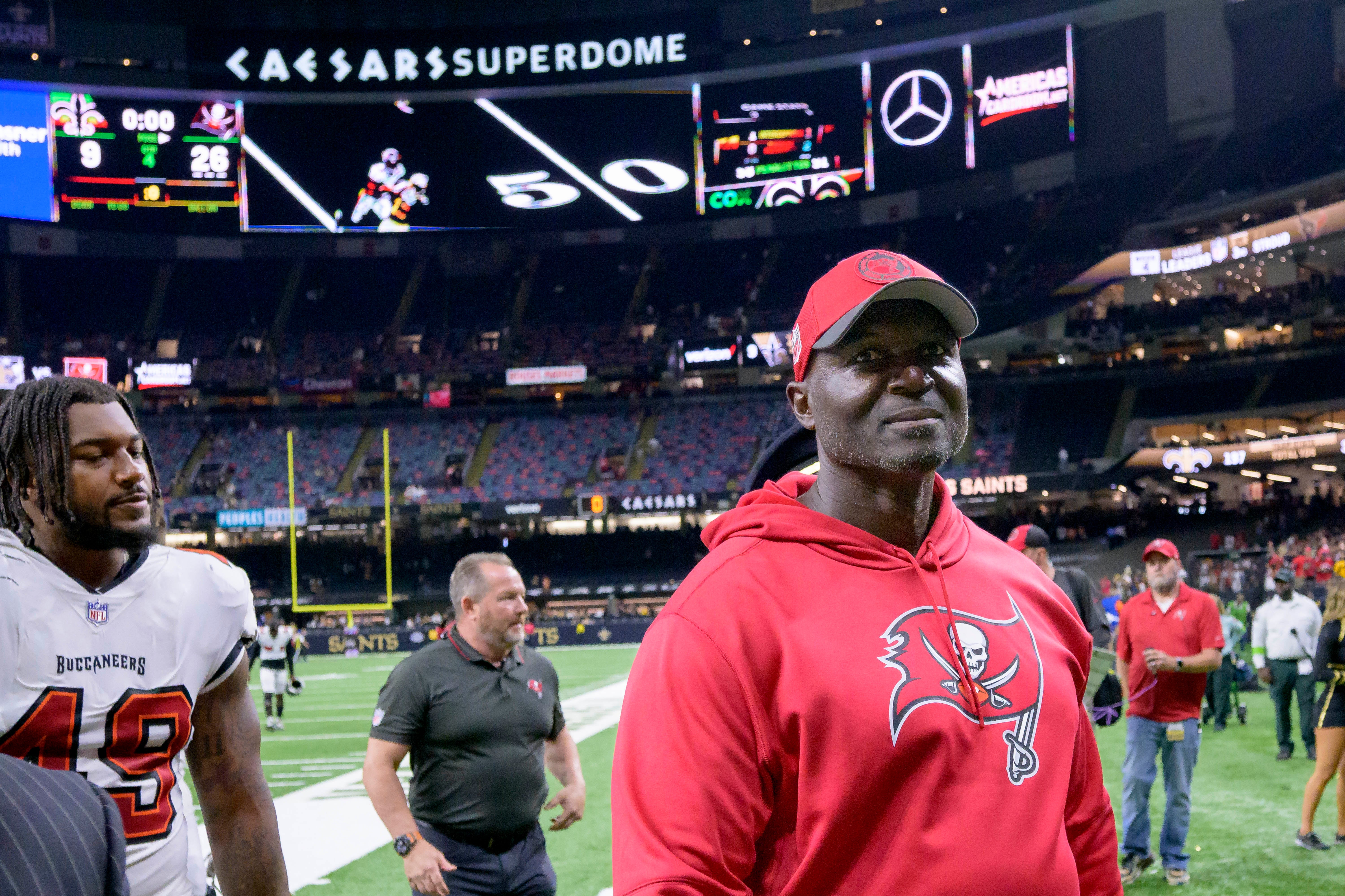Oct 1, 2023; New Orleans, Louisiana, USA; Tampa Bay Buccaneers head coach Todd Bowles, right, walks off the field after his team s victory 26-9 over the New Orleans Saints at the Caesars Superdome. Mandatory Credit: Matthew Hinton-USA TODAY Sports