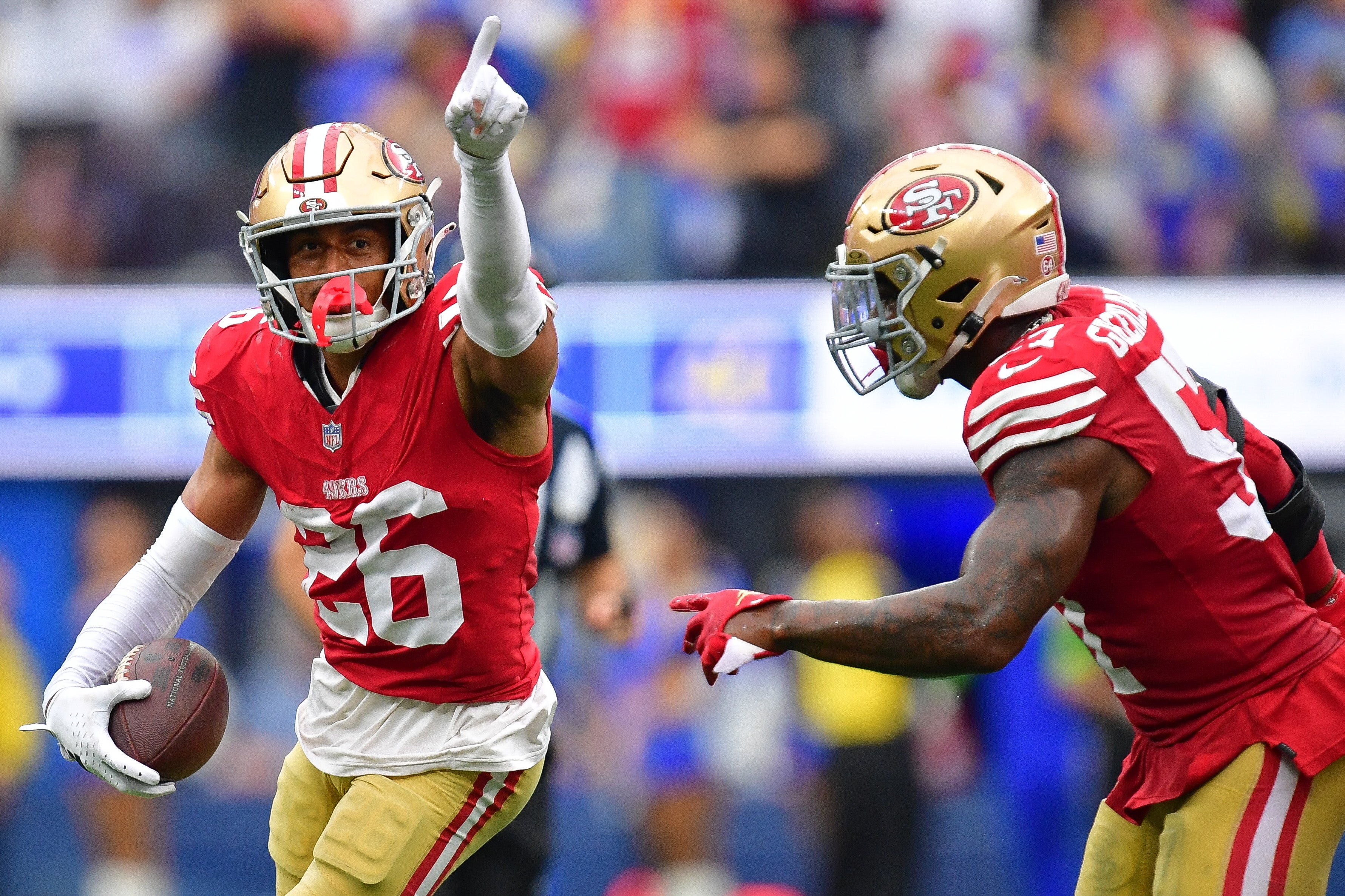Sep 17, 2023; Inglewood, California, USA; San Francisco 49ers cornerback Isaiah Oliver (26) celebrates after recovering a fumble against the Los Angeles Rams with linebacker Dre Greenlaw (57) during the second half at SoFi Stadium.