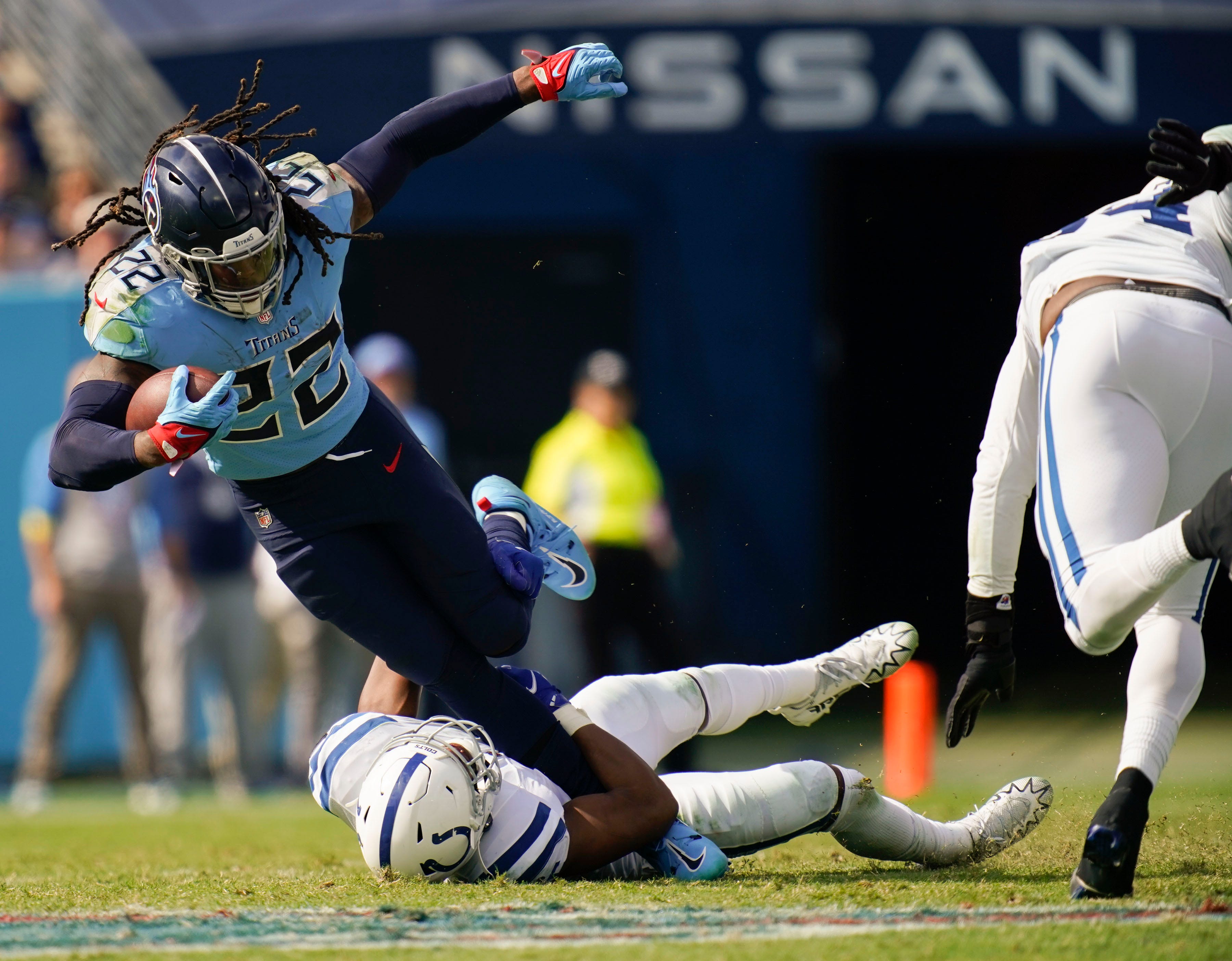 Oct 23, 2022; Nashville, Tennessee, USA; Tennessee Titans running back Derrick Henry (22) is tackled by Indianapolis Colts linebacker E.J. Speed (45) during the third quarter at Nissan Stadium Sunday, Oct. 23, 2022, in Nashville, Tenn.