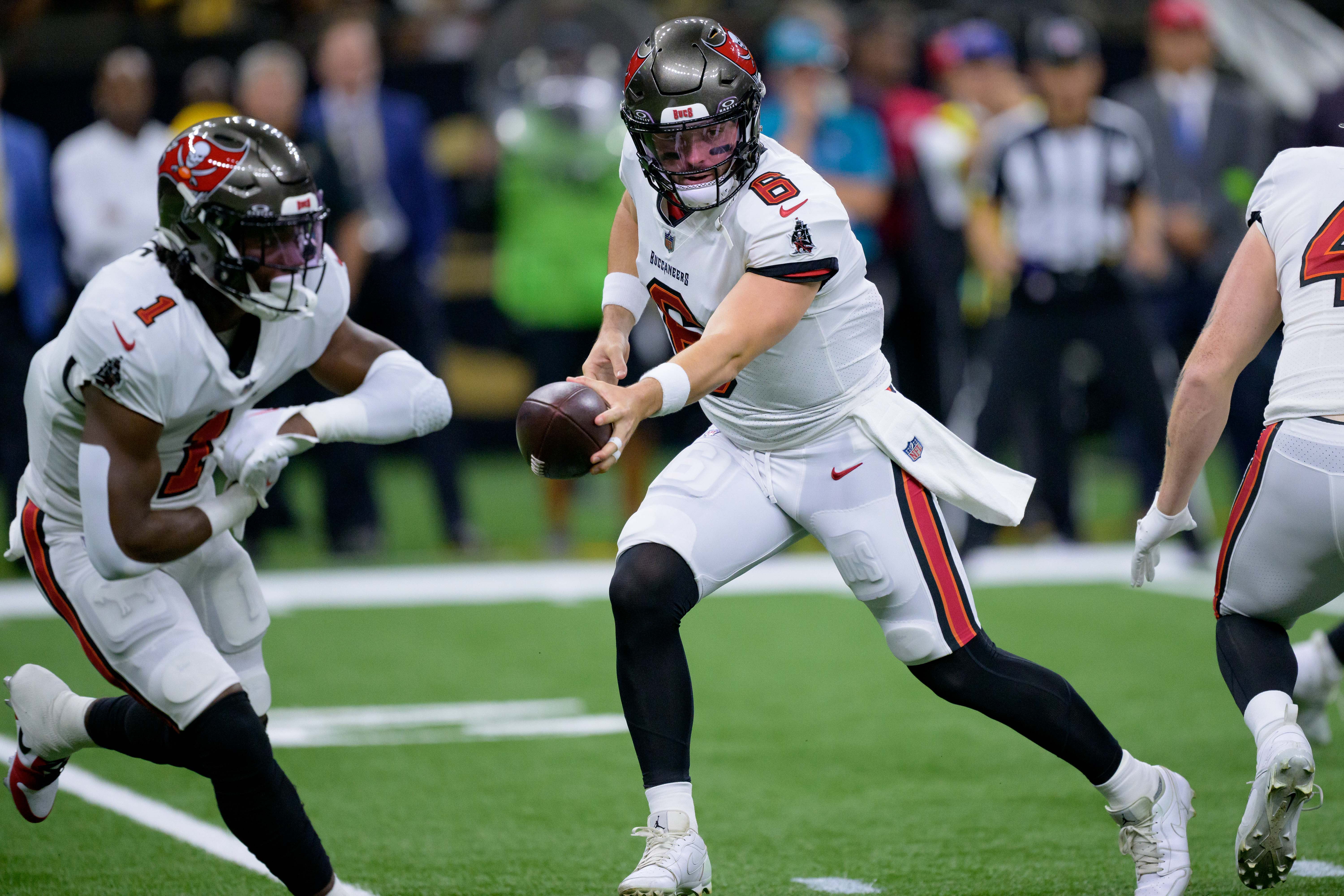 Oct 1, 2023; New Orleans, Louisiana, USA; Tampa Bay Buccaneers quarterback Baker Mayfield (6) fakes a handoff to running back Rachaad White (1) against the New Orleans Saints during the second quarter at Caesars Superdome. Mandatory Credit: Matthew Hinton-USA TODAY Sports