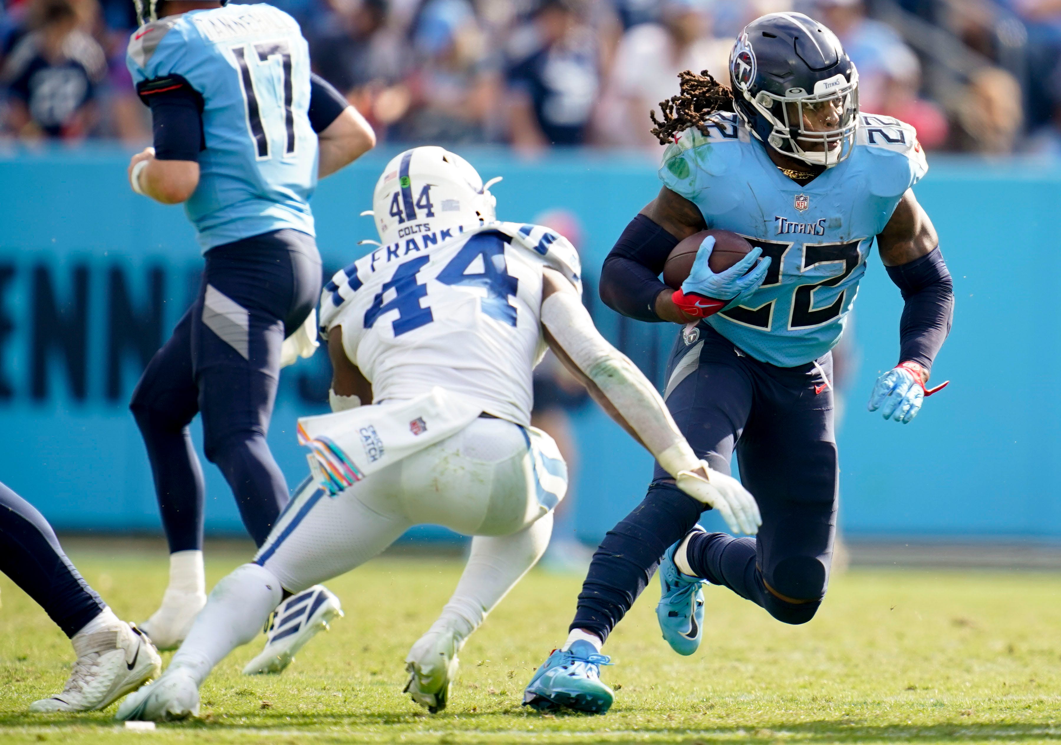 Tennessee Titans running back Derrick Henry (22) runs the ball past Indianapolis Colts linebacker Zaire Franklin (44) during the fourth quarter at Nissan Stadium Sunday, Oct. 23, 2022, in Nashville, Tenn. Nfl Indianapolis Colts At Tennessee Titans