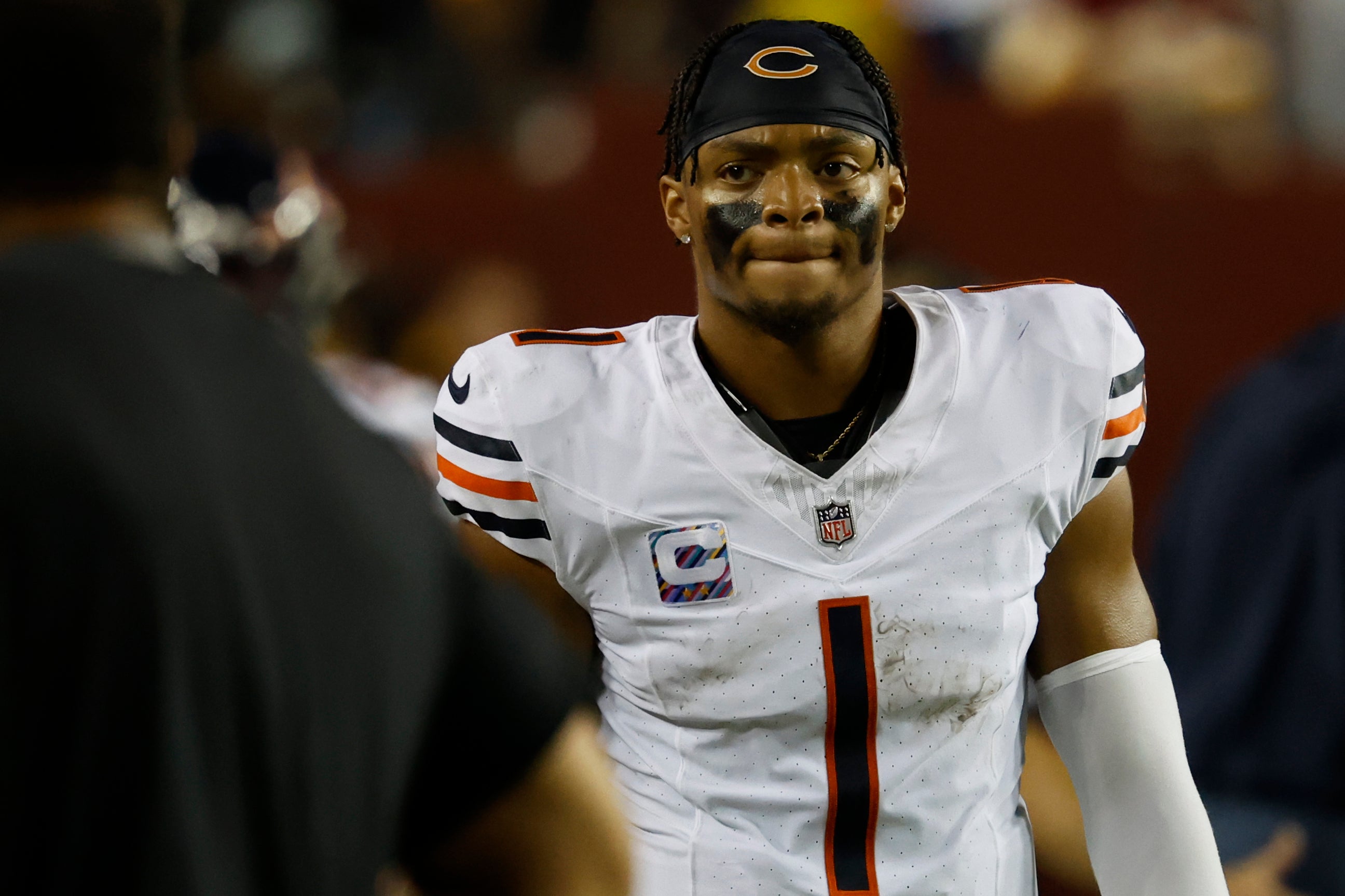 Oct 5, 2023; Landover, Maryland, USA; Chicago Bears quarterback Justin Fields (1) stands on the sidelines after throwing a touchdown pass against the Washington Commanders during the second quarter at FedExField.