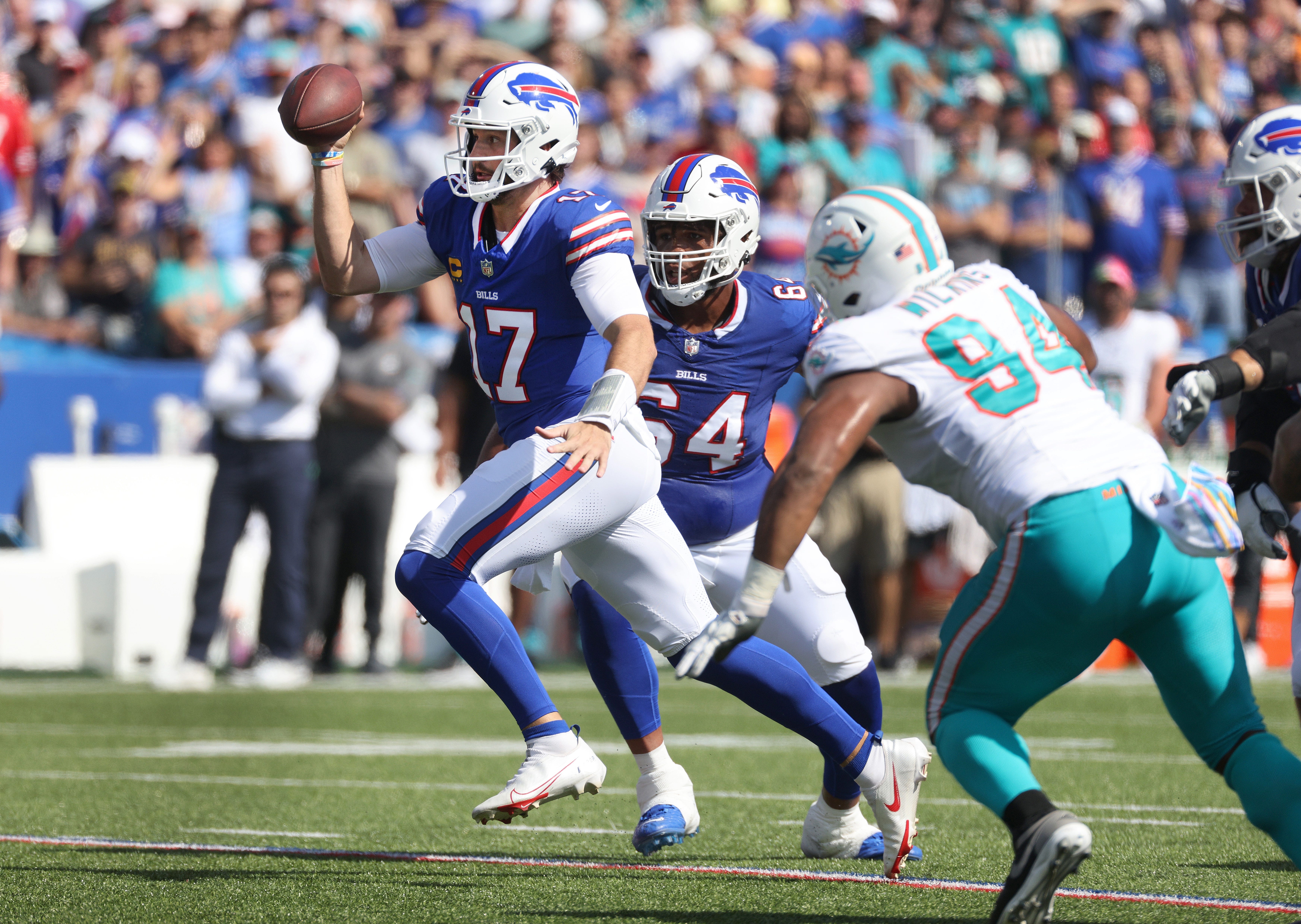 Buffalo Bills QB Josh Allen evading tackles against the Miami Dolphins